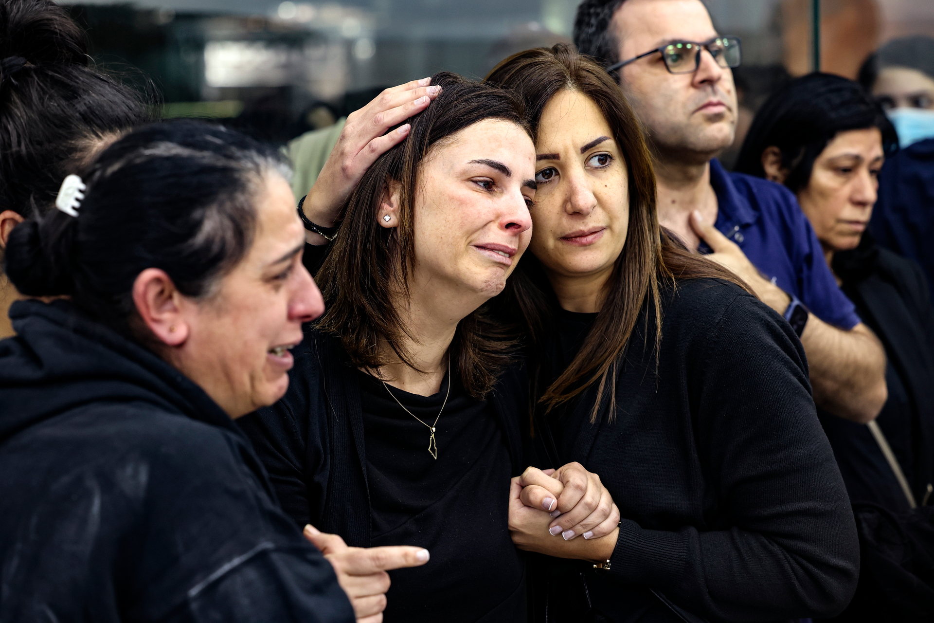 Colleagues and friends react as the Palestinian flag-draped body of veteran Al-Jazeera journalist Shireen Abu Akleh is brought to the offices of the news channel's office in the West Bank. Photo / AP