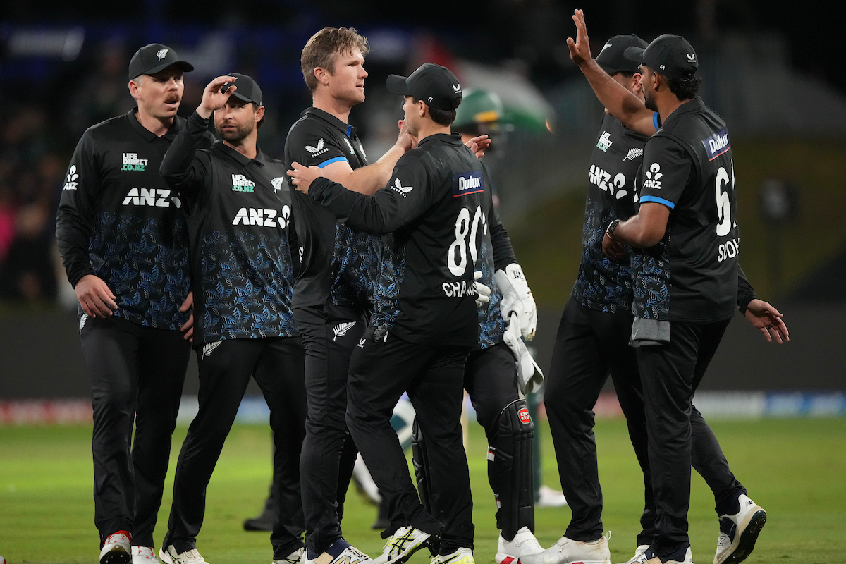The Black Caps celebrate a Jimmy Neesham wicket against Australia at Bay Oval. Photo / Photosport