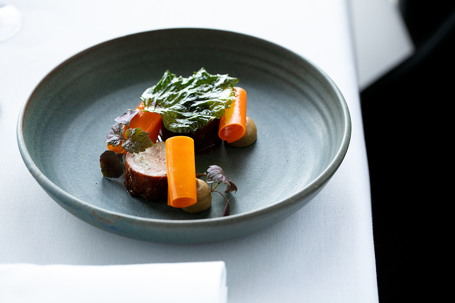 The quail, with pistachio, carrot and perilla. Photo / Babiche Martens