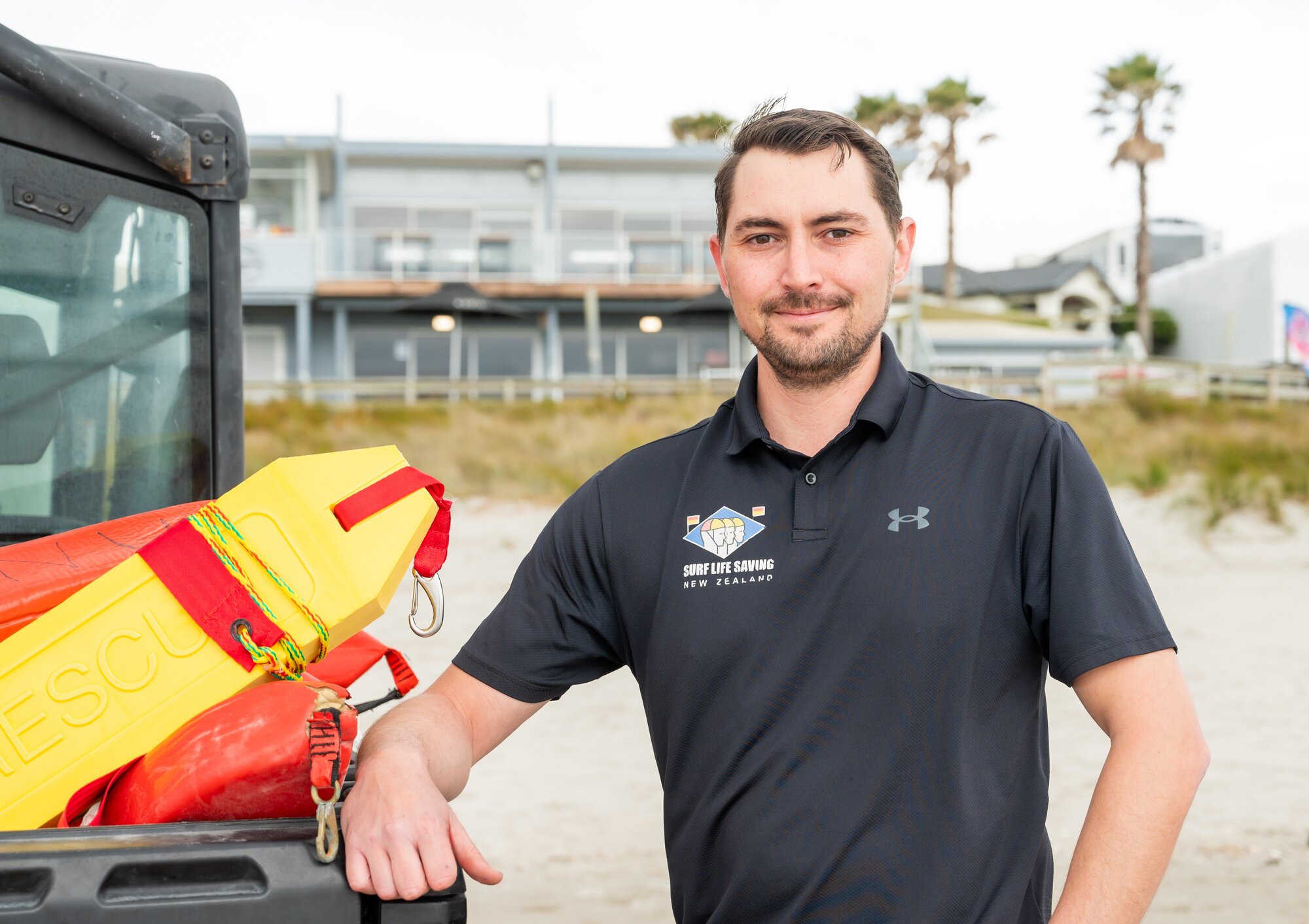 Eastern region lifesaving manager Chaz Gibbons-Campbell in front of the Mount Maunganui Surf Club. Photo / Brydie Thompson