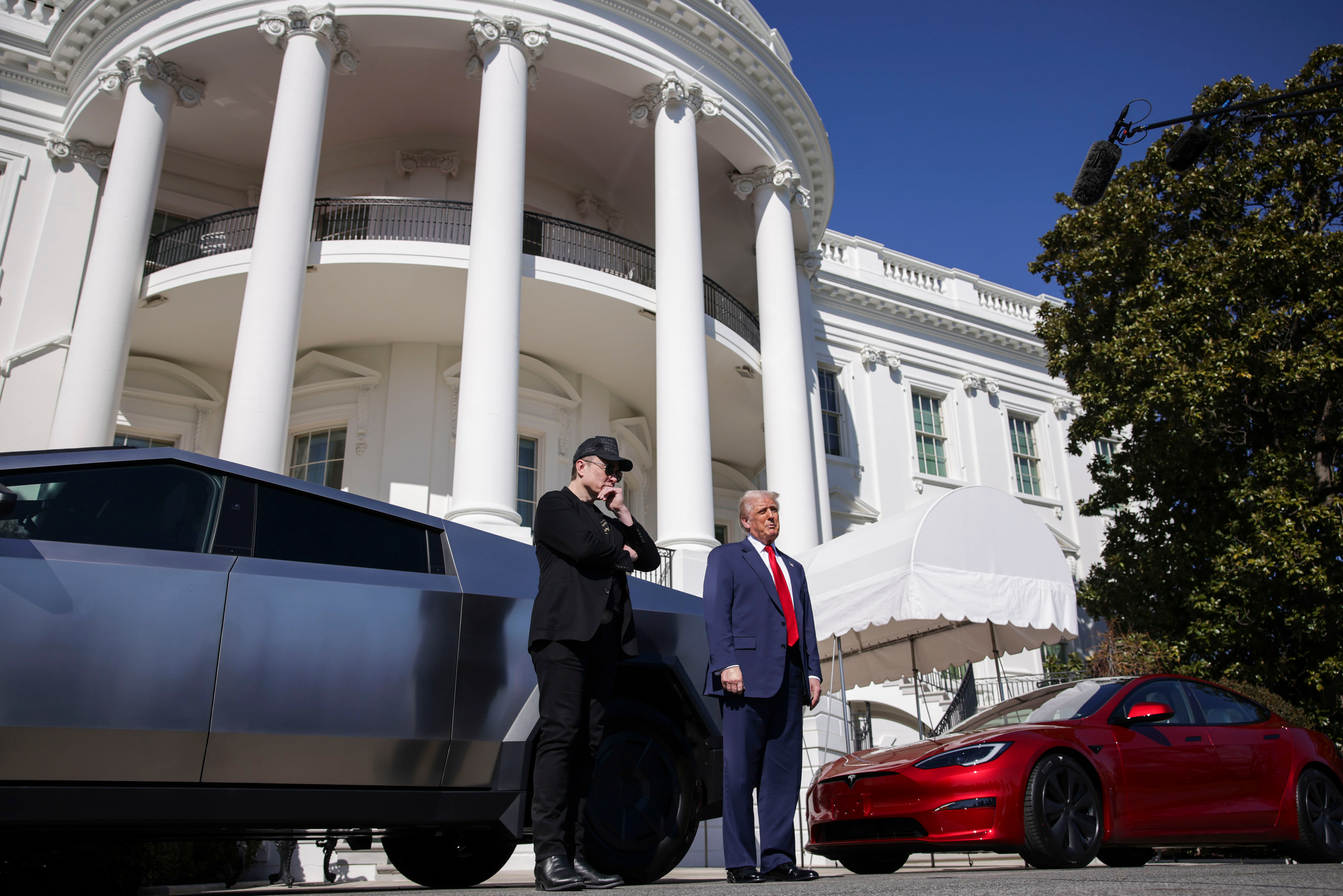 Tesla chief executive Elon Musk with US President Donald Trump on March 11. Trump said he'll buy a new Tesla to support Elon Musk, after shares of the electric-car maker had their worst day in four years amid a growing backlash over Musk's political allegiances. Photo / Getty Images