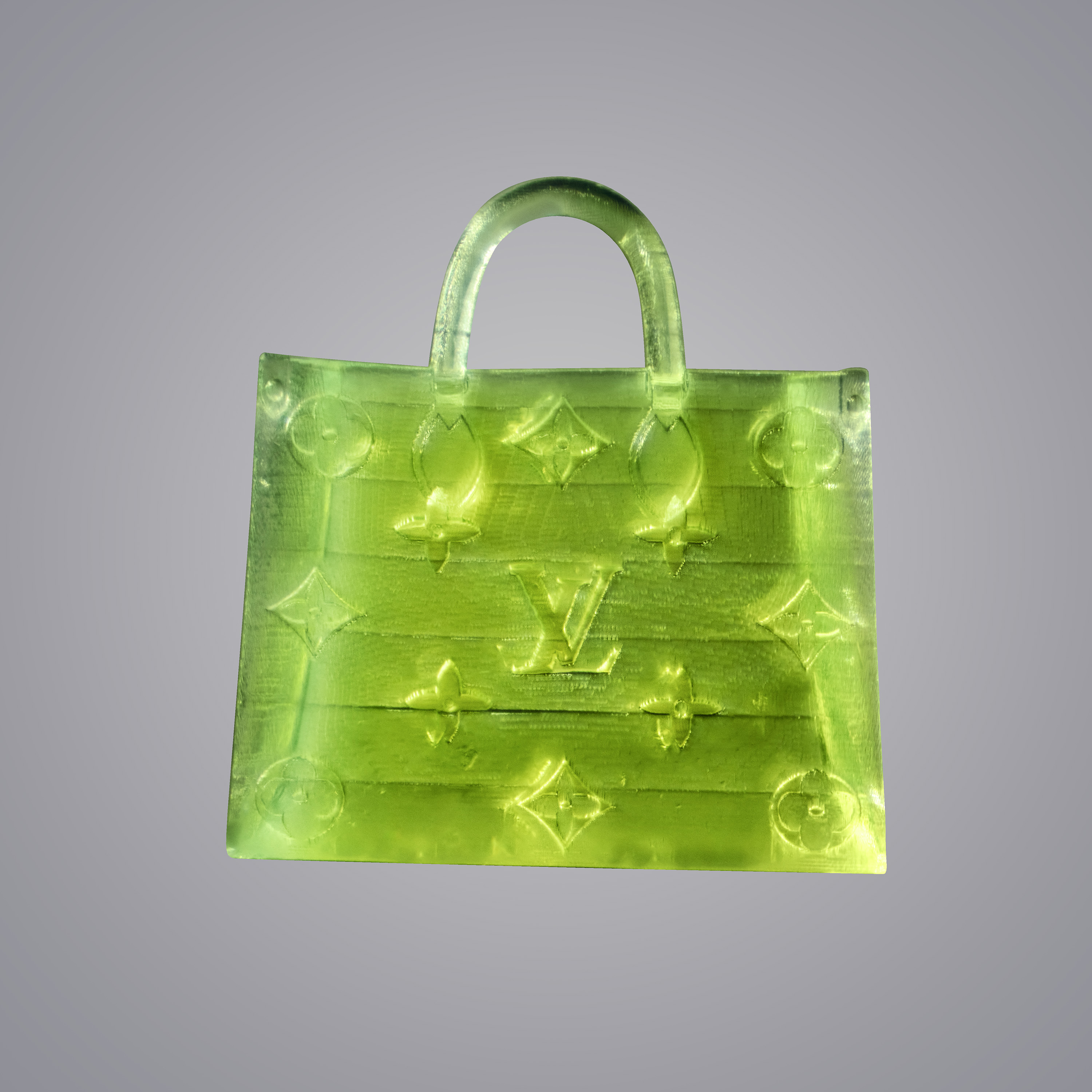 From afar, the fluorescent green bag looks like a radioactive poppy seed or a fragment of a sprinkle. Only when it is magnified are its translucent handles and Louis Vuitton monogram clearly visible. Photo / MSCHF via The New York Times