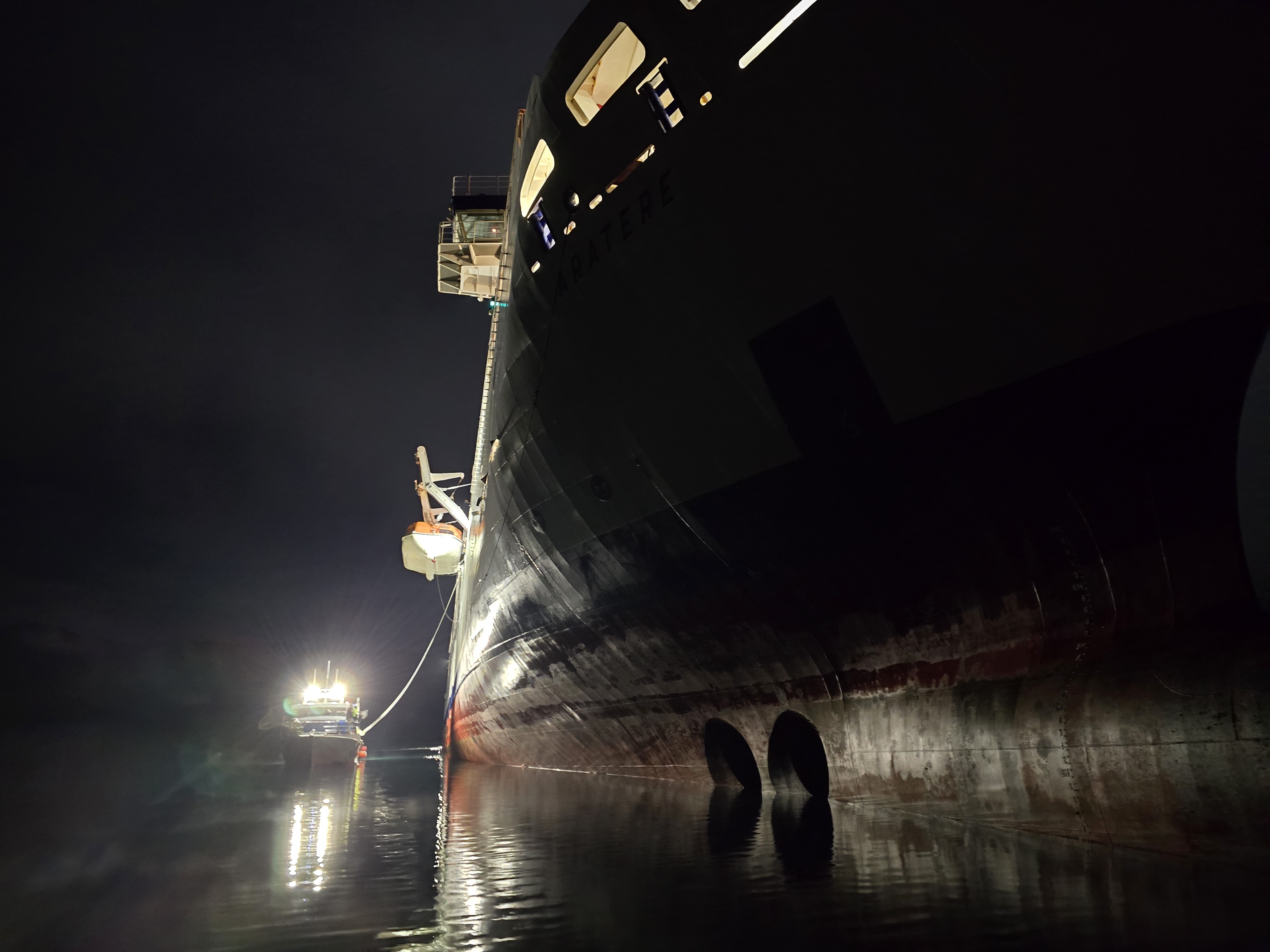 Support vessels attach lines to the stricken Interislander ferry Aratere. 

