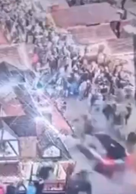 Still from video shared online which purportedly shows a car ploughing into a crowd at a Christmas market in the German city of Magdeburg.