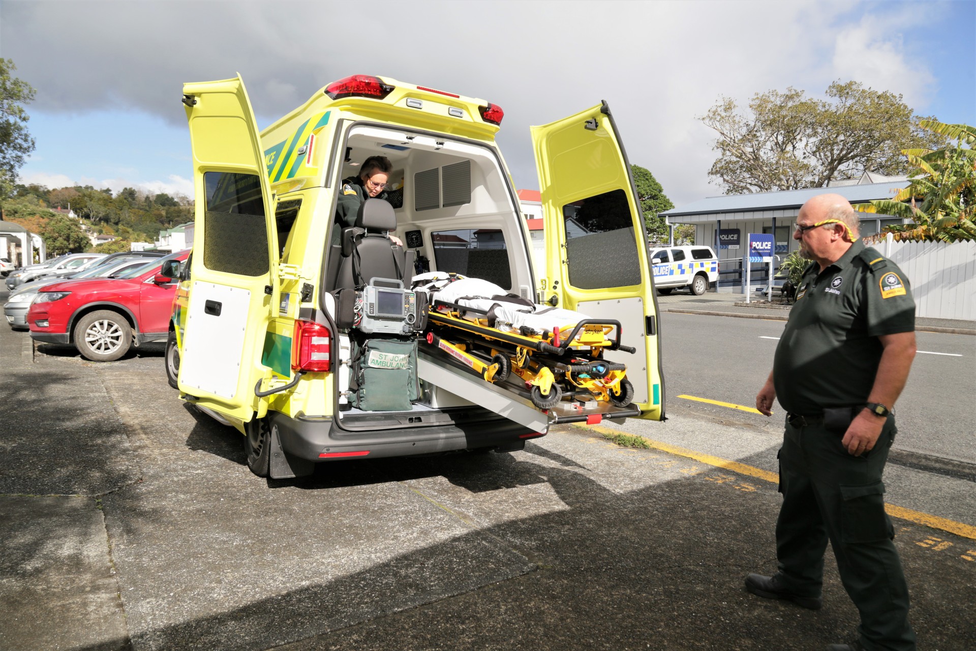 Russell St John staff members check out their new vehicle. Photo / Stephen Western
