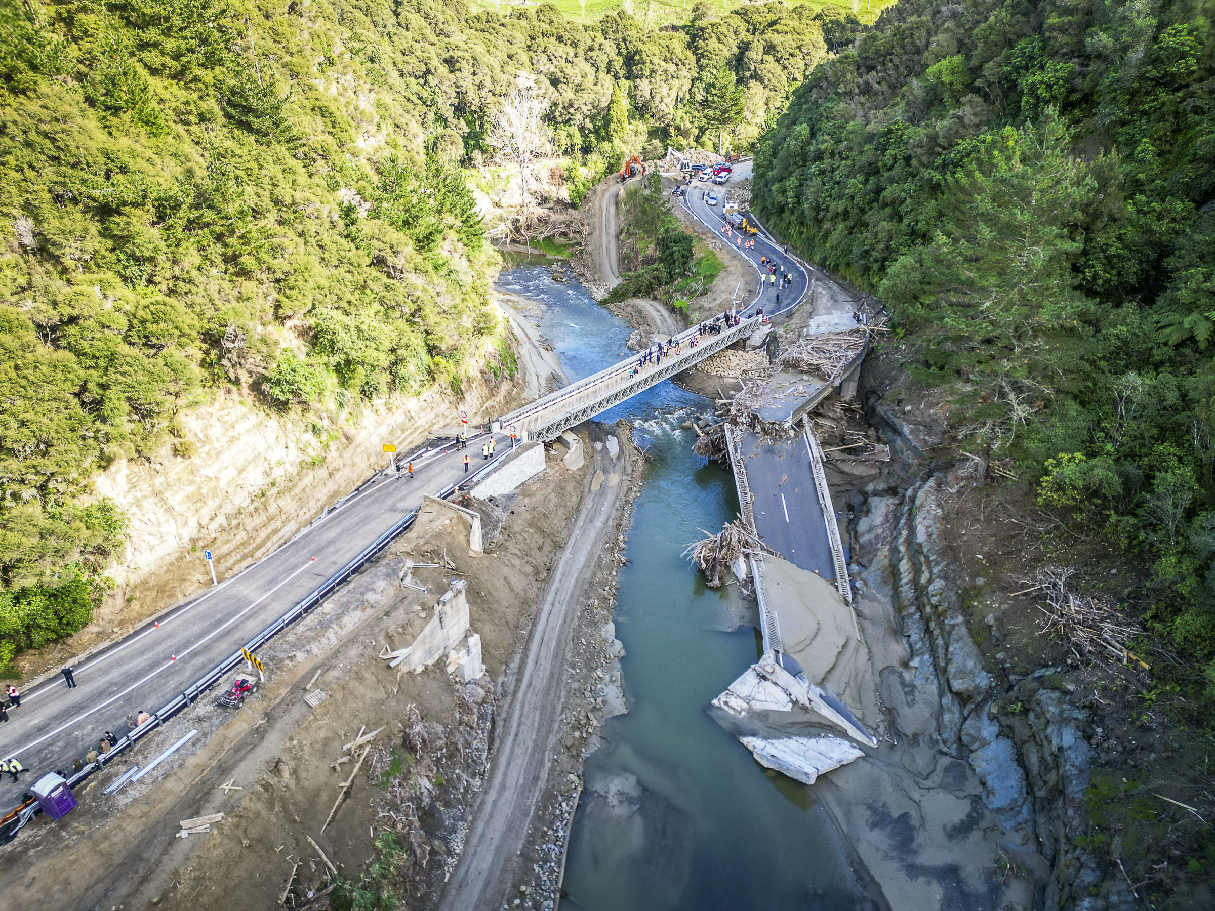 The destroyed Waikare River Bridge and the new Bailey bridge in May. Photo / Paul Taylor