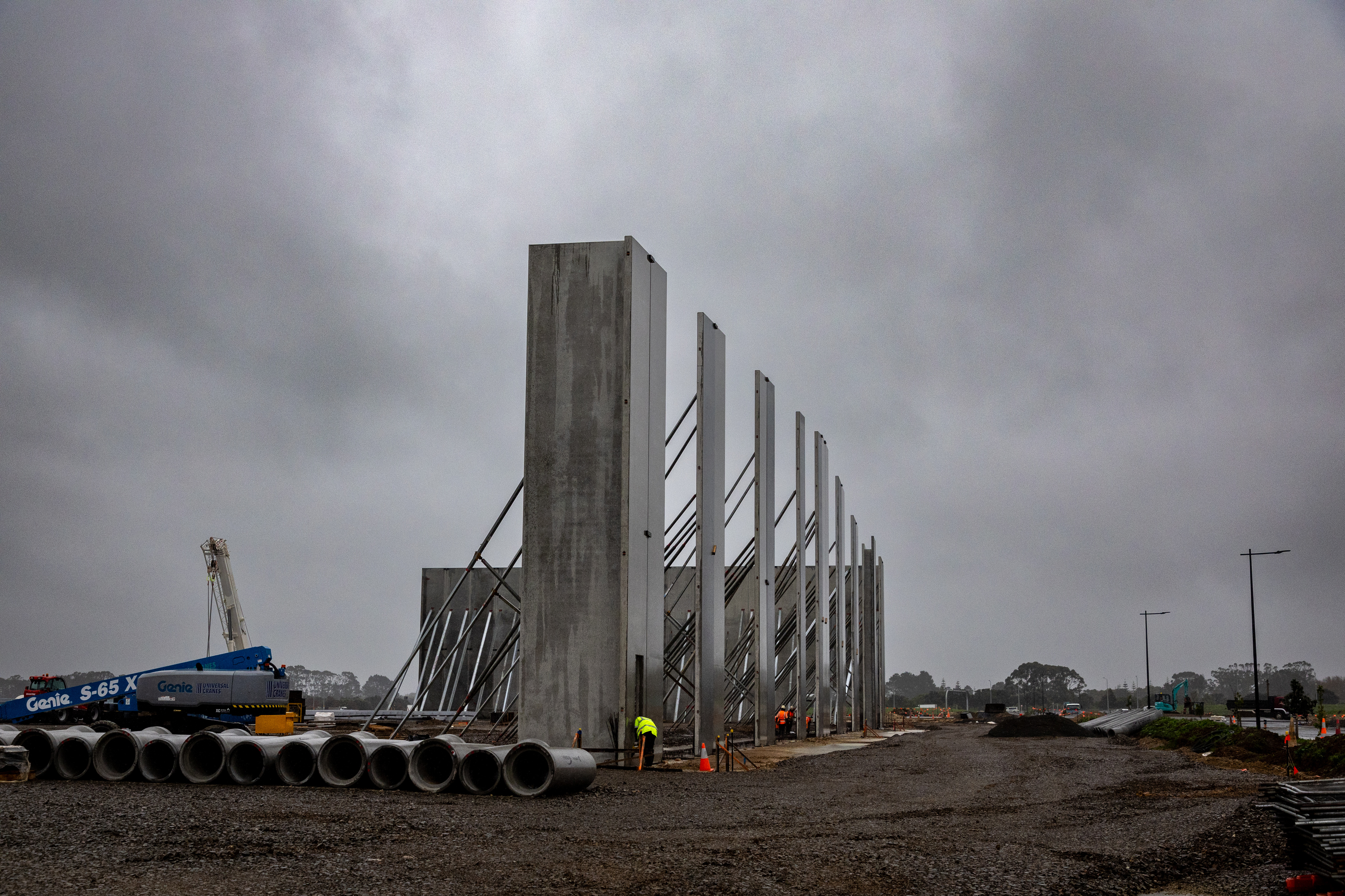 Like a prehistoric monument rising from the landscape, walls for the first logistics buildings are pictured at the site. Photo / Michael Craig