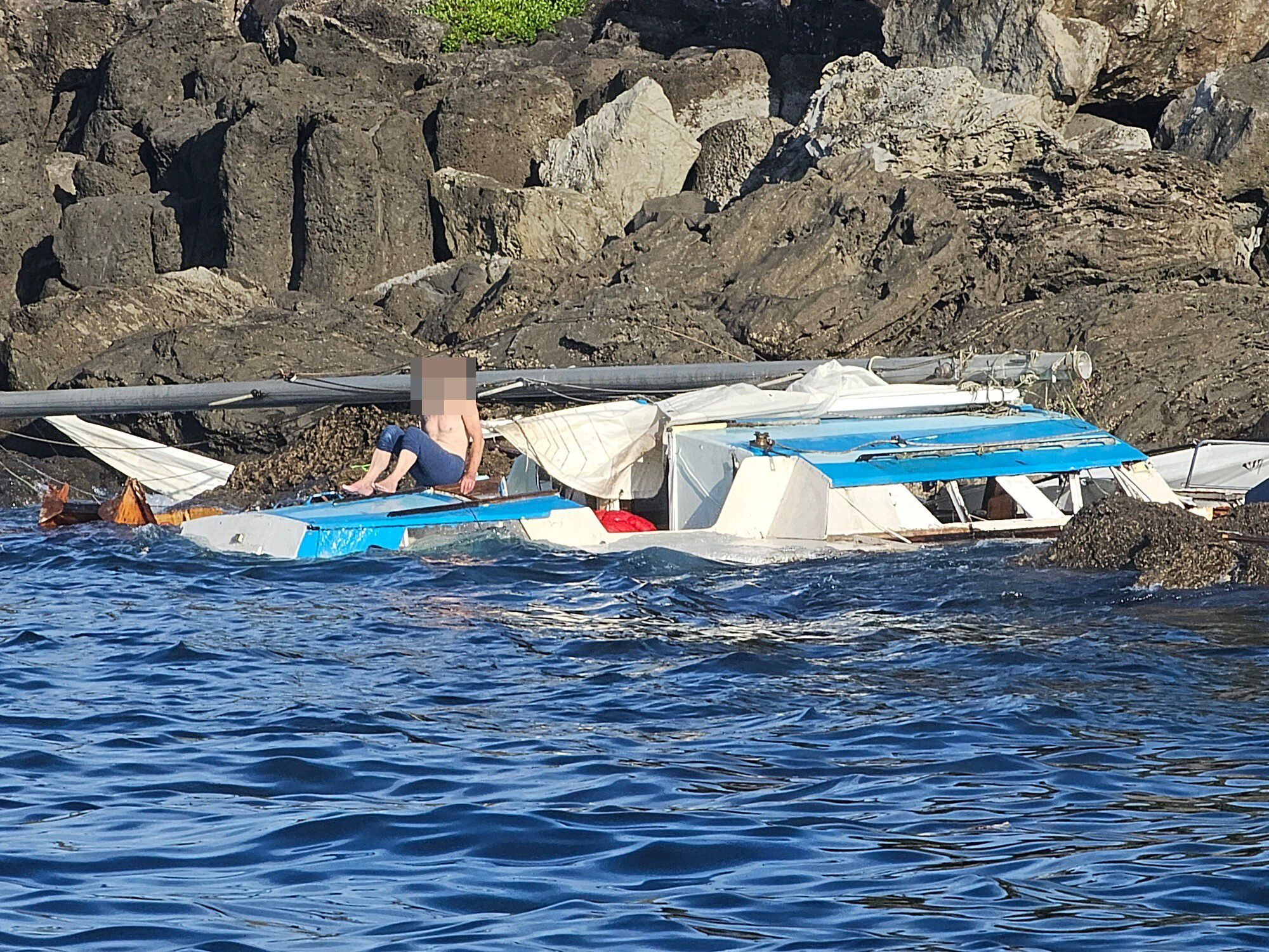 The scene when the coastguard arrived to rescue two men from the trimaran Moana Nui, which was wrecked on rocks at Motueka/Flat Island in November. Photo / supplied