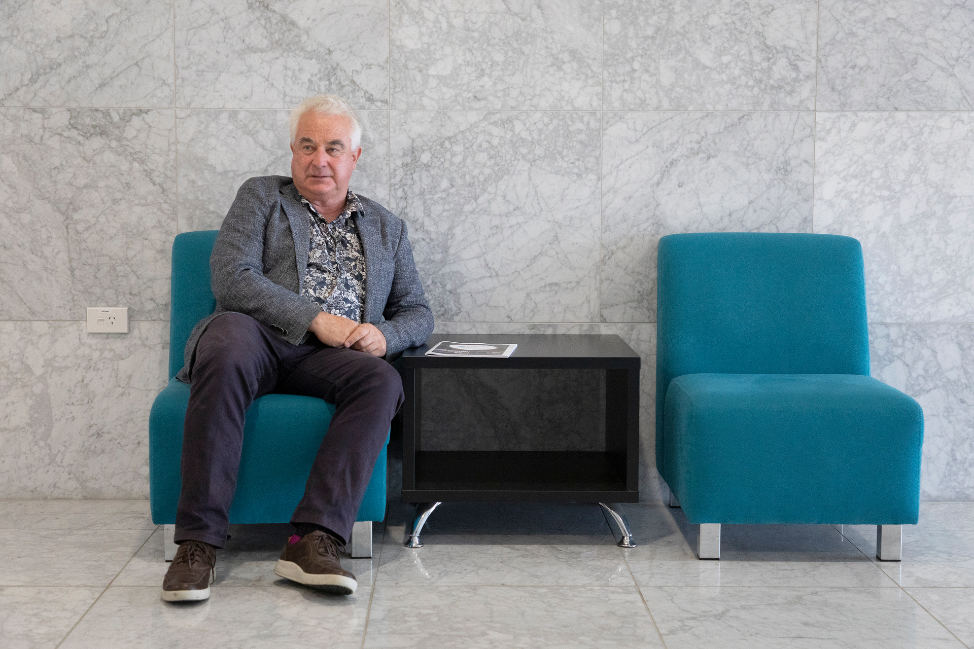 Former Tauranga mayor Greg Brownless waits outside a meeting where an extension of a commission at the city council is confirmed. Photo / Andrew Warner