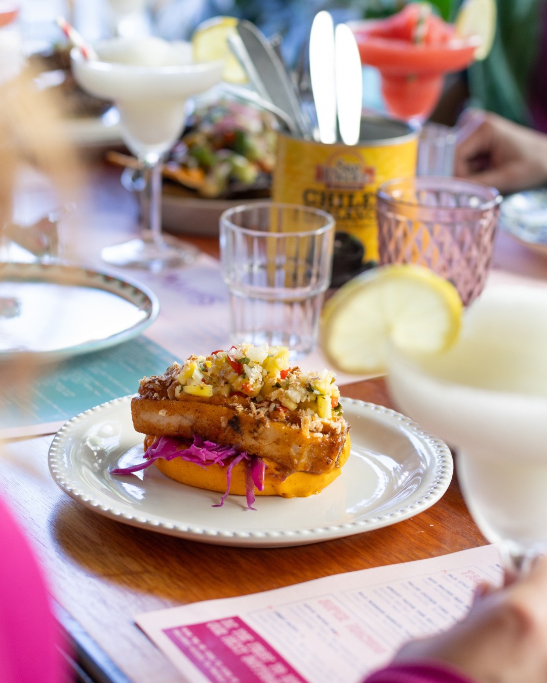 Margo's apricot pastor pork belly bao. Photo / @margos_qt