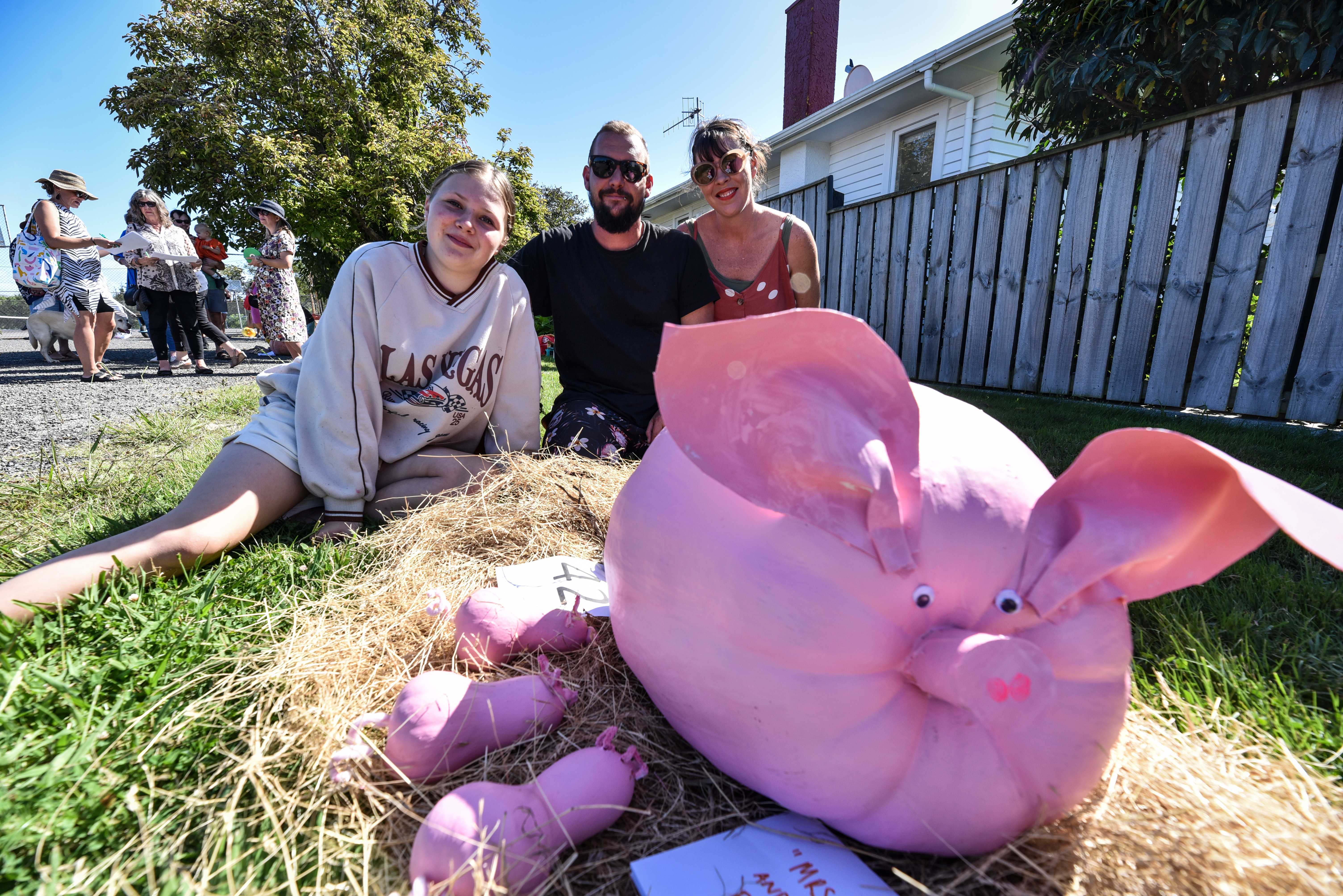 Jaz Sheppherd-Lowe, Pauly Lowe and Harriet Garland-Levett with their entry to the Haumoana Pumpkin Competition. Photo / Ian Cooper