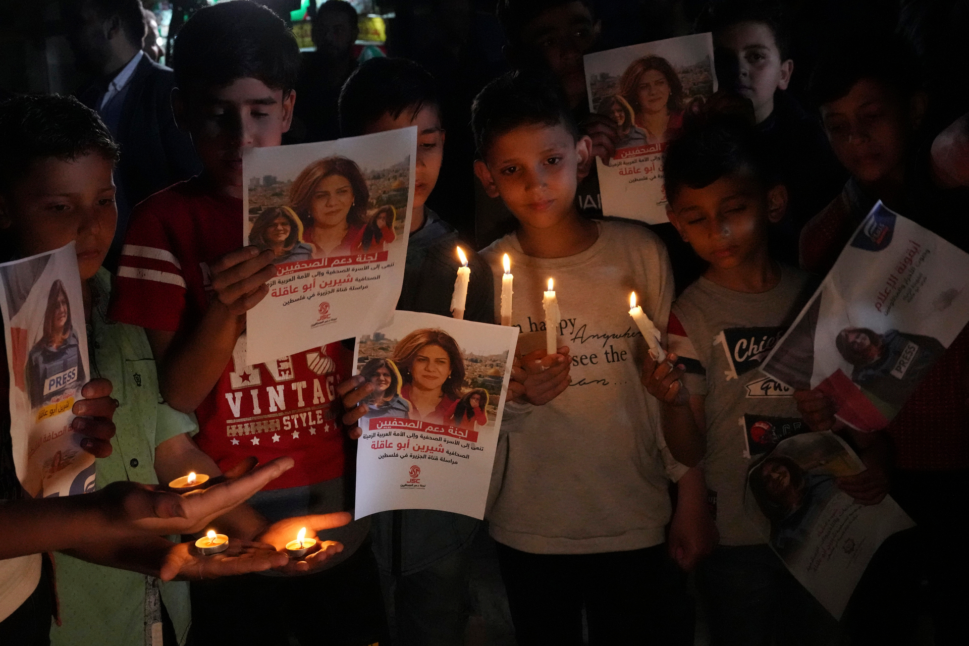 Palestinian children carry light candles and pictures of slain Al Jazeera journalist Shireen Abu Akleh in Gaza City. Photo / AP