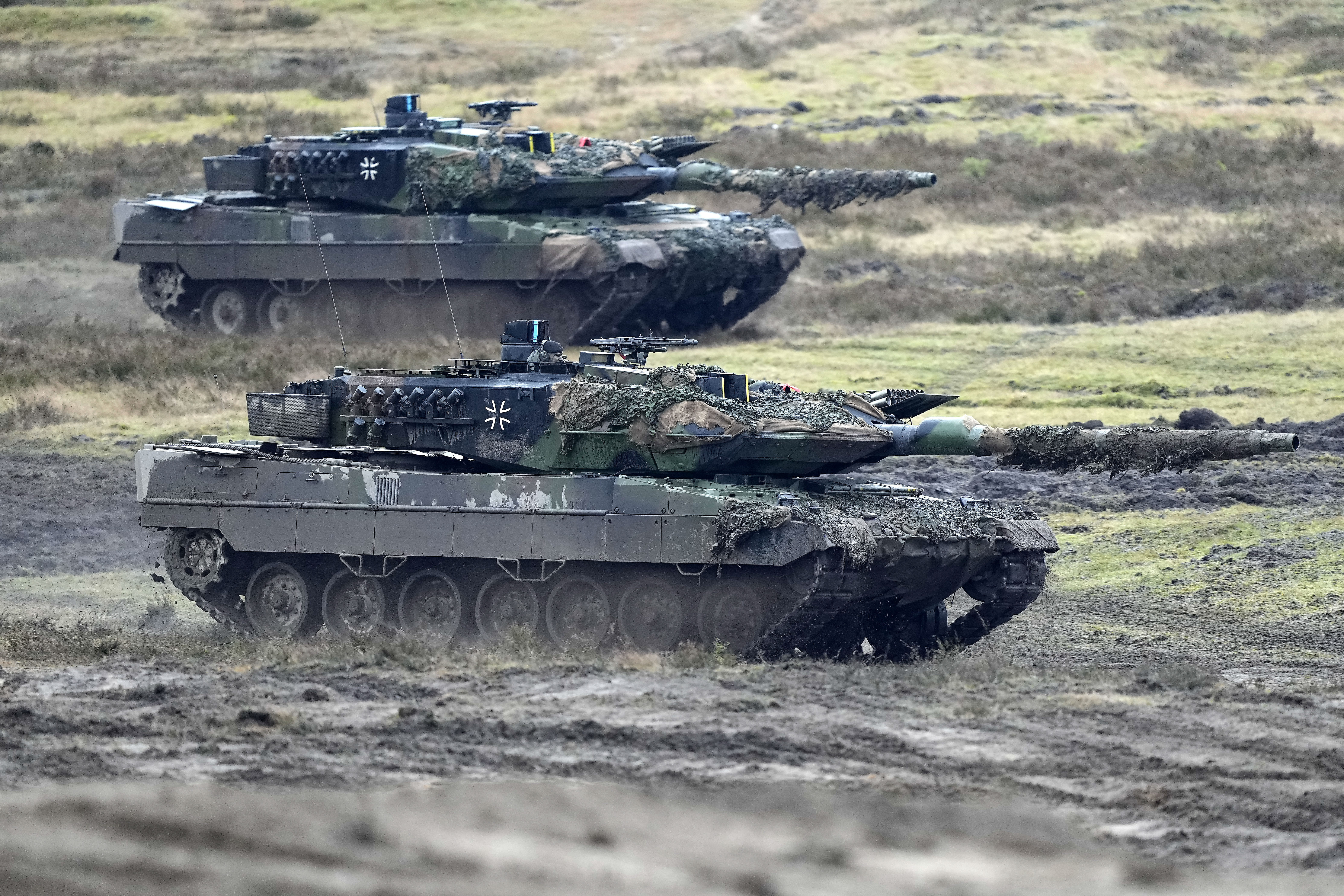 Two Leopard 2 tanks are seen in action during a visit of German Defense Minister Boris Pistorius at the Bundeswehr tank battalion 203 at the Field Marshal Rommel Barracks in Augustdorf, Germany in February.  Photo / AP