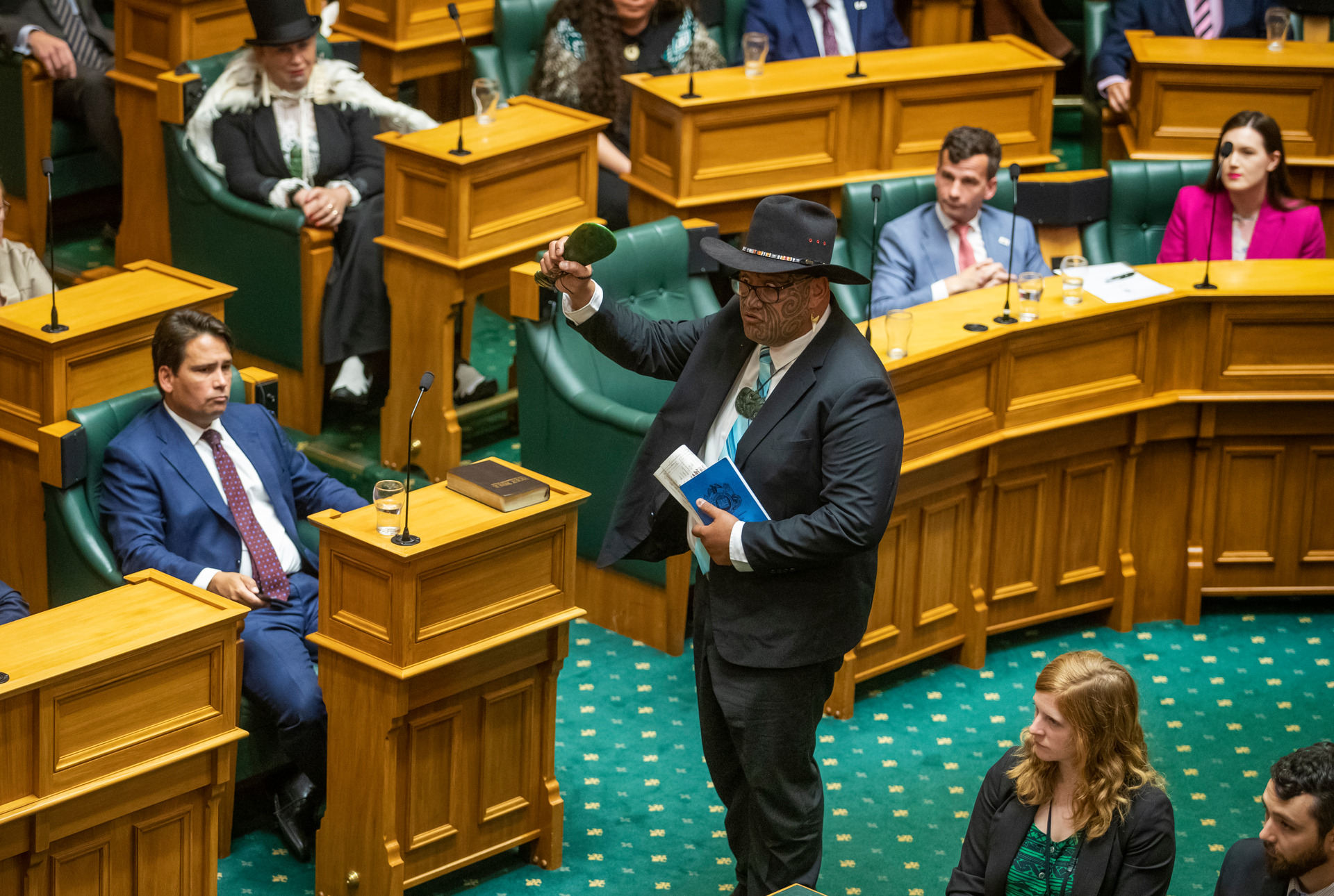 Maori Party co-leader Rawiri Waititi waving a mere as he walks up to swear the oath during the Commission Opening of Parliament. Photo / Mark Mitchell