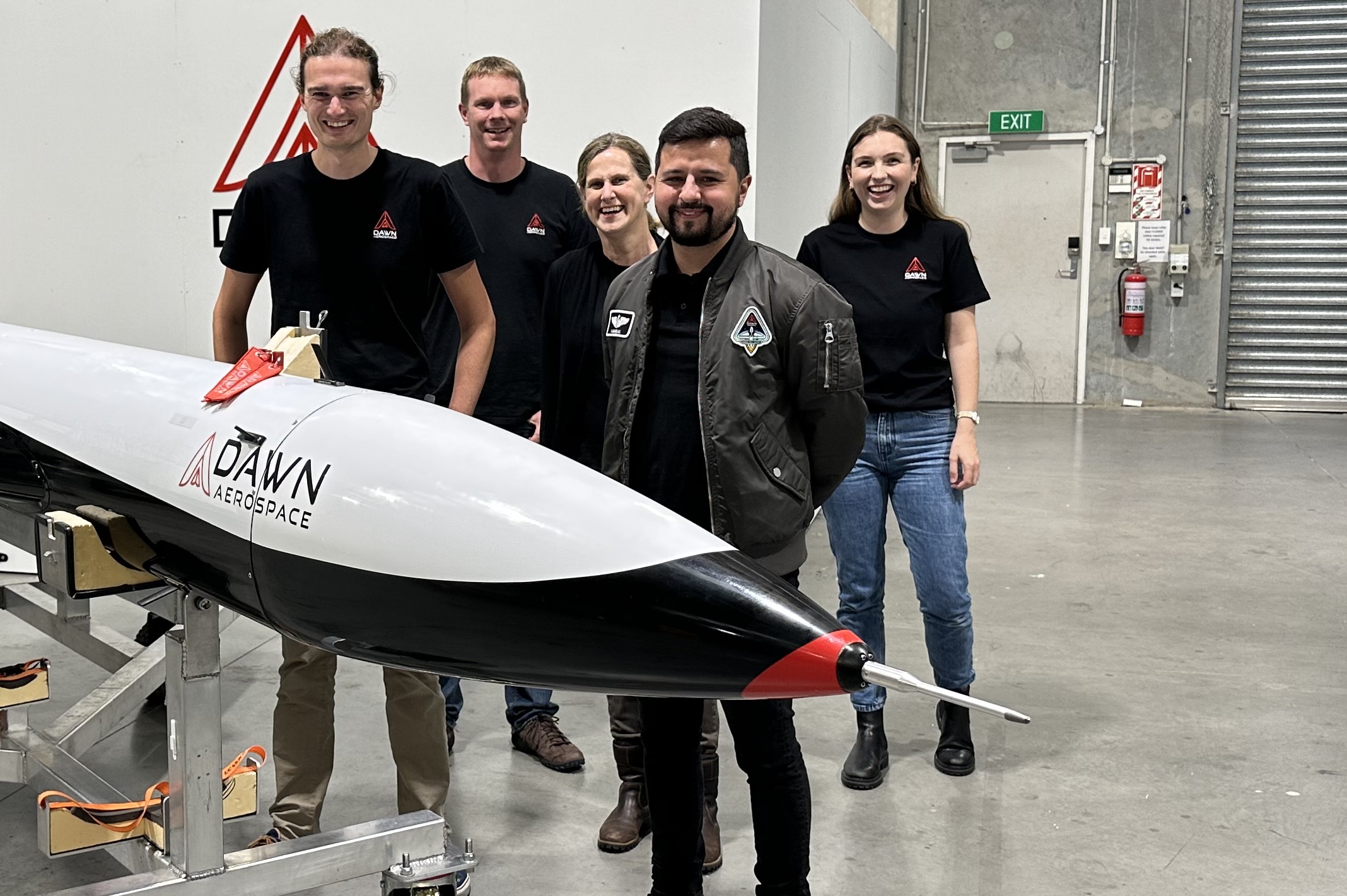 With Dawn Aerospace's Mk-II Aurora spaceplane are CEO and CTO Stefan Powell, operations lead Tim Dutton, finance manager Vivien Knight, test pilot Iagho Amaral and sales and marketing manager Catherine Moreau Hammond. Photo / Chris Keall
