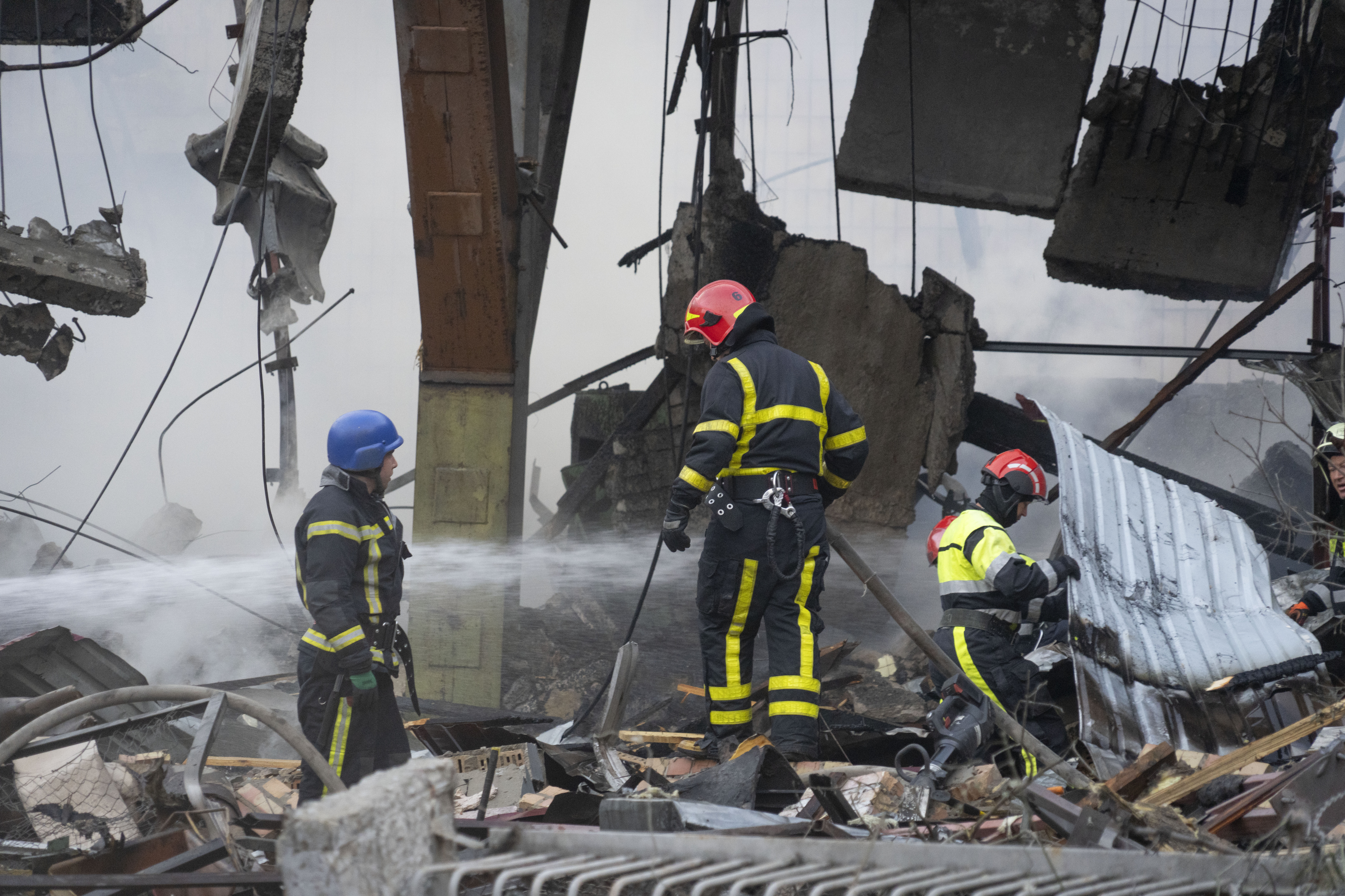 Firefighters put out a fire after a Russian rocket attack in Kyiv on Wednesday, August 30. Over 20 rockets and drones have been shot down by the air defence system in Kyiv overnight. Photo / AP