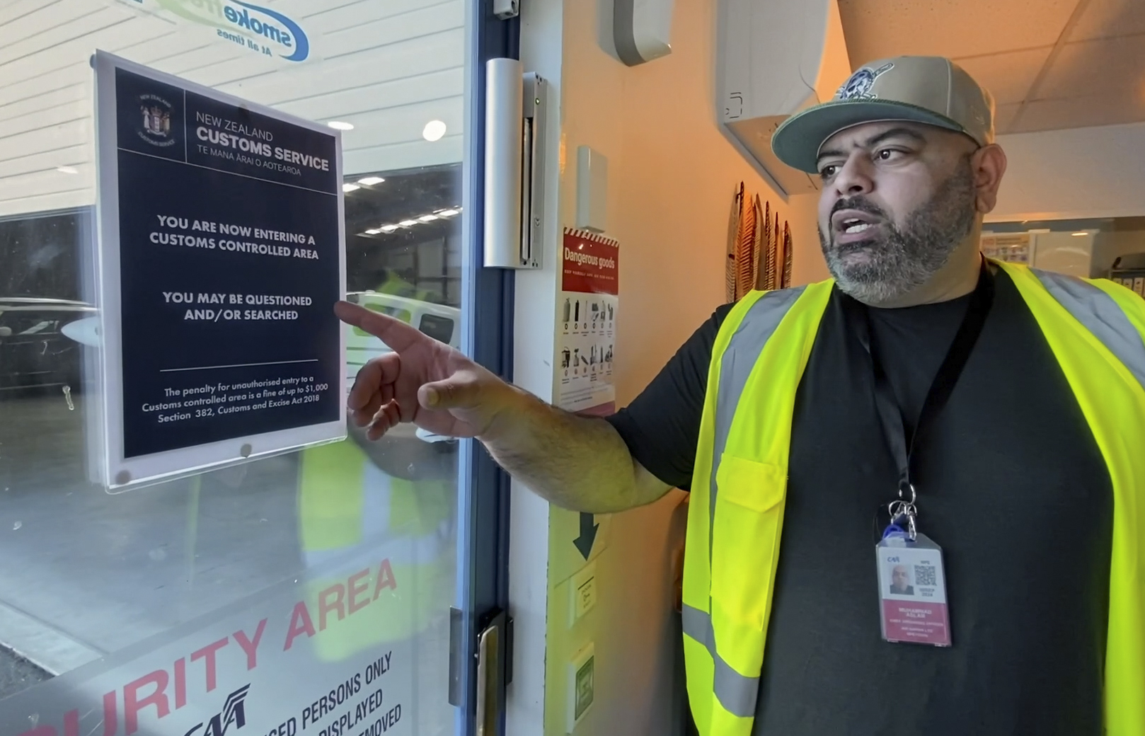 Air Napier chief operating officer Arsel Aslam shows the new signs that indicate a Customs-controlled area, meaning private international passengers can arrive and depart the building. Photo / Warren Buckland