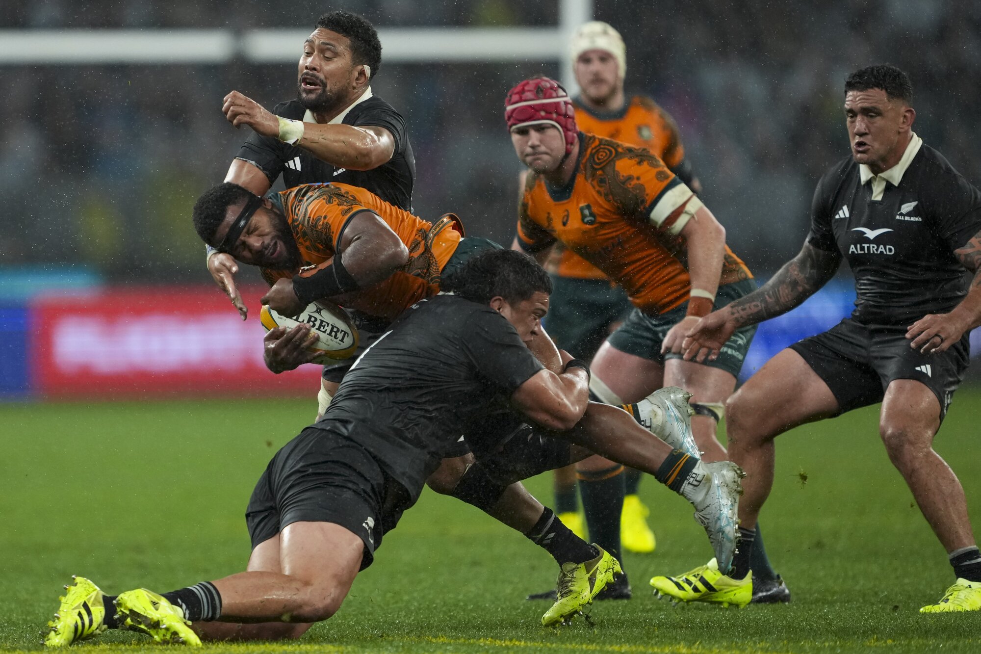 Tamaiti Williams (front) and Ardie Savea make another tackle in the test against the Wallabies in Perth. Photo / SmartFrame