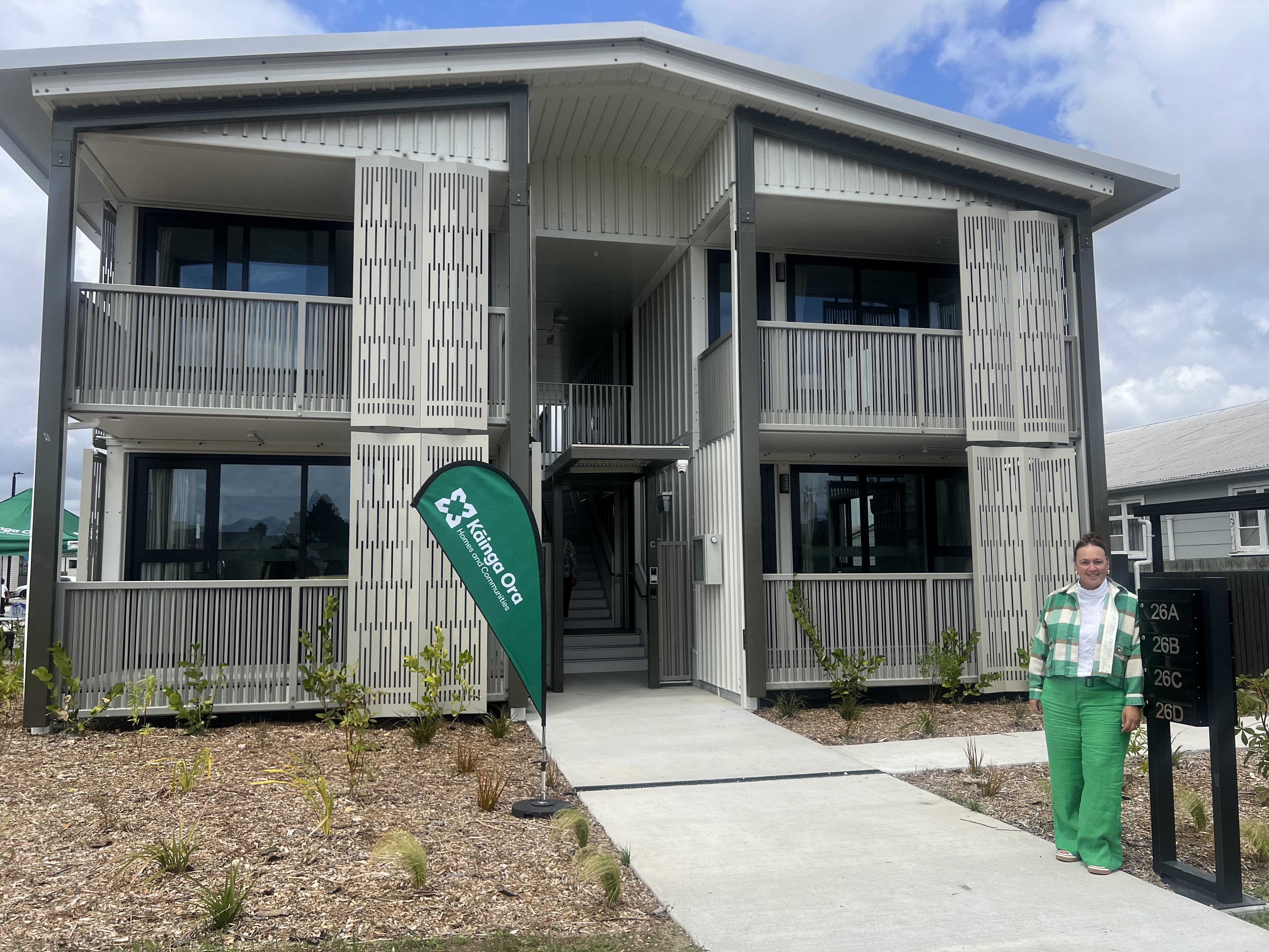 Kāinga Ora Bay of Plenty housing and wellbeing support manager Teresa Pou outside one of the completed apartment blocks on the corner of Malfroy Rd and Ranolf St. Photo / Kelly Makiha