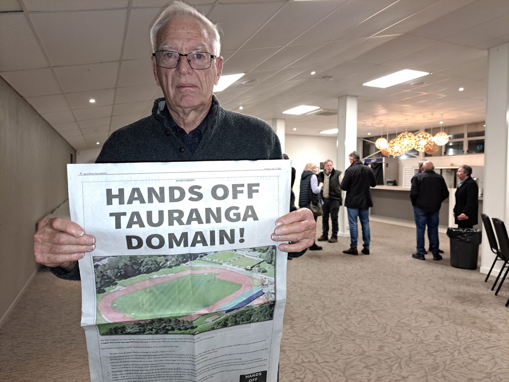 Ōmokoroa resident Michael Galloway makes his feelings known at a Hands Off Tauranga Domain protest meeting at the Tauranga Racecourse. Photo / Sandra Conchie