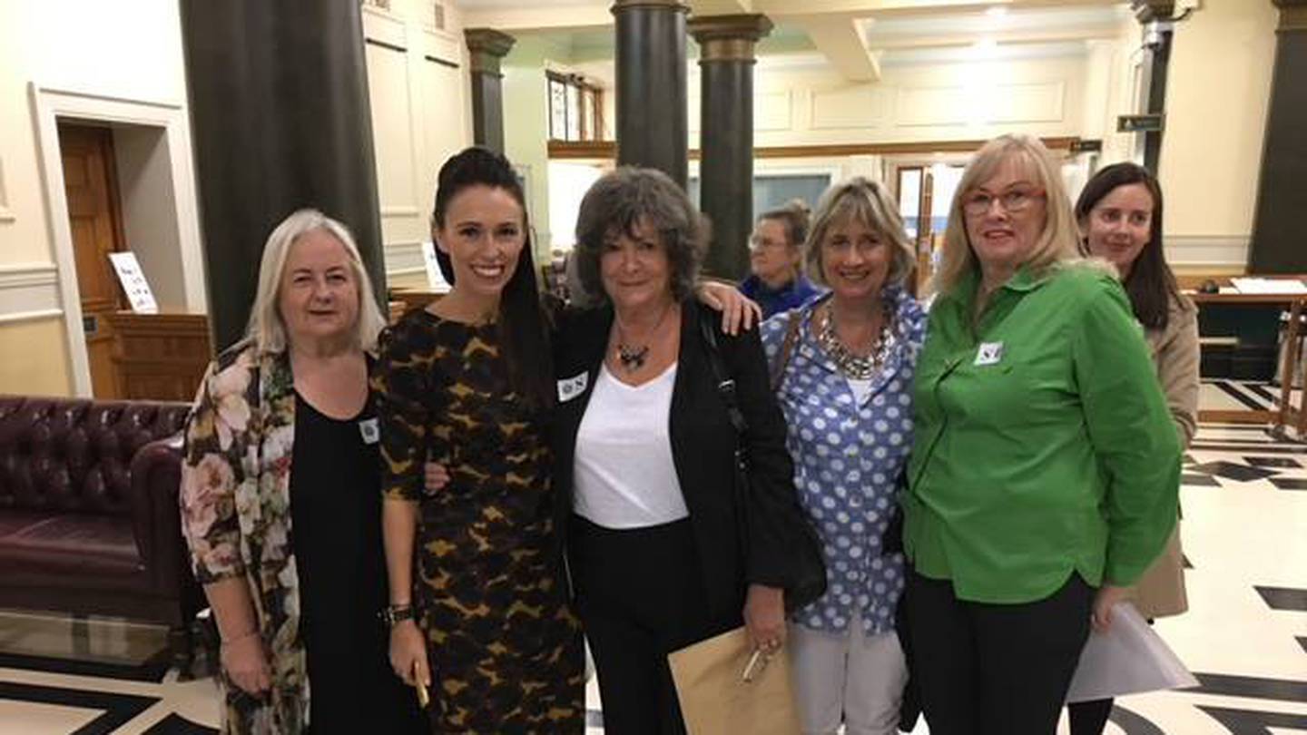 Jacinda Ardern with Maggie Wilkinson and other petitioners for an inquiry into forced adoption, in March 2017. Photo / Supplied