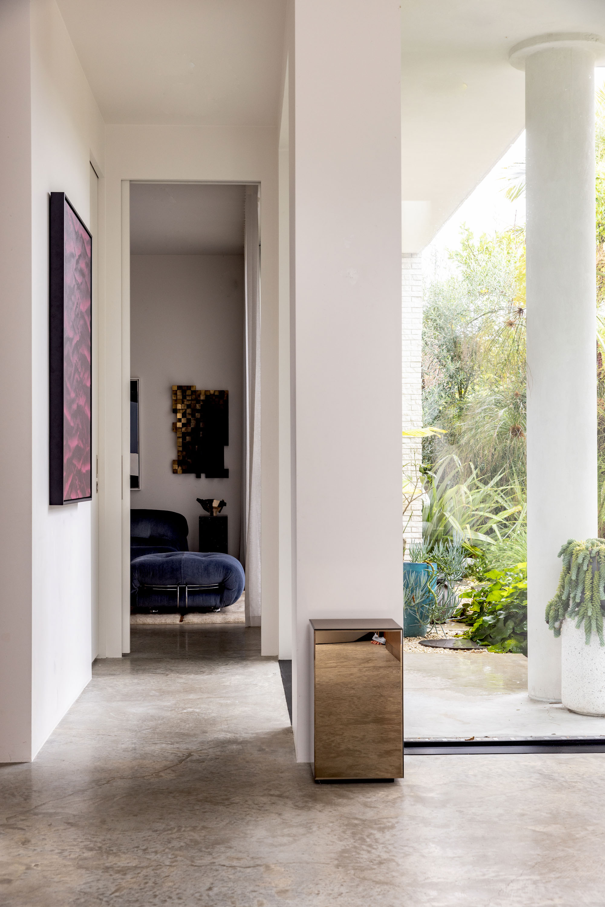 High ceilings and polished concrete floors create an art gallery effect in the foyer. Photo / Babiche Martens