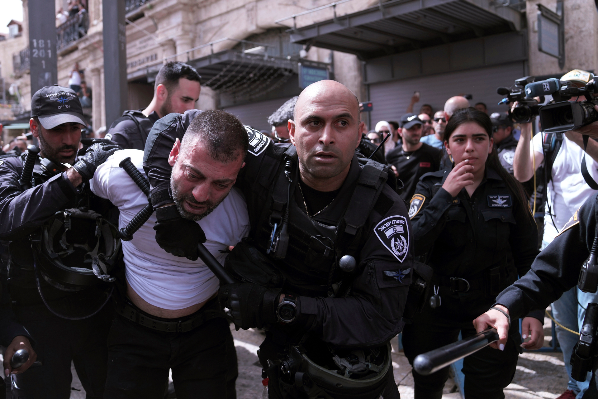 Israeli police detain a man during the funeral for slain Al Jazeera veteran journalist Shireen Abu Akleh in the Old City of Jerusalem. Photo / AP