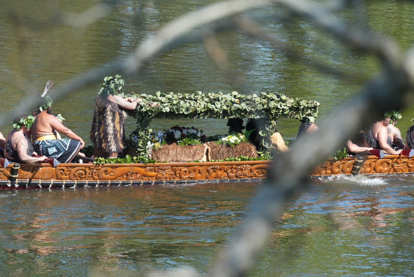 The waka is carrying the casket of the late King, as well as his grieving family, including newly-anointed Kuini Ngā Wai hono i te pō. Photo / Carson Bluck