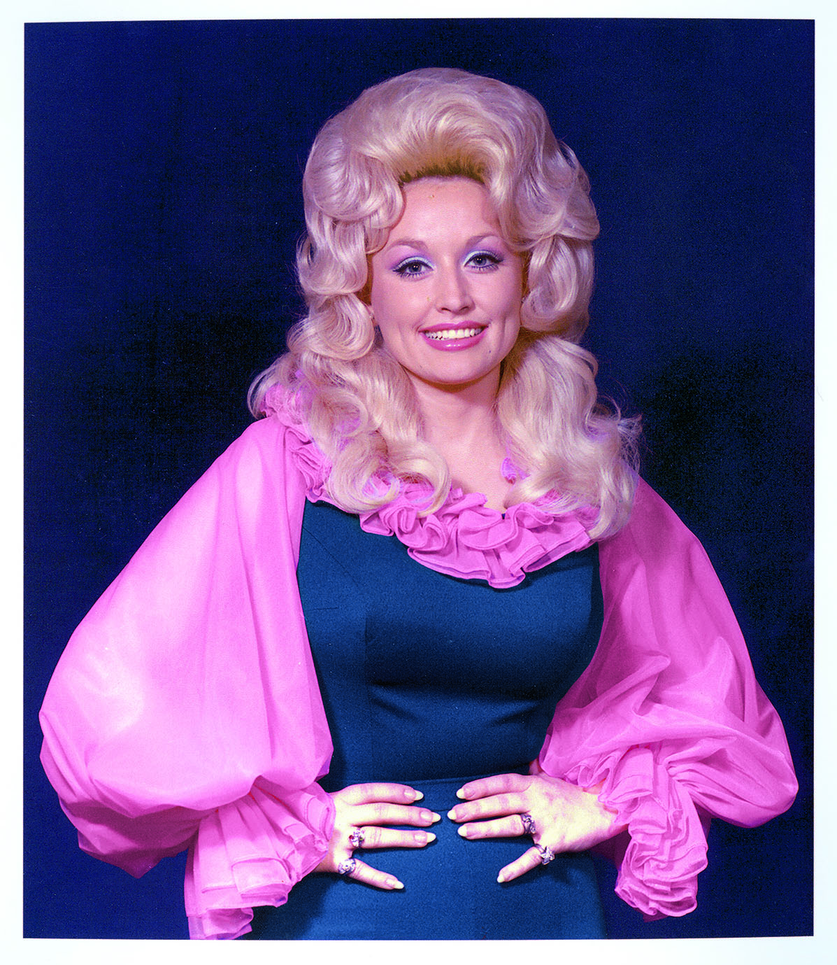 Dolly Parton in an early on-stage staple — a stretchy jumpsuit accented with chiffon. Photo / Dolly Parton Archive