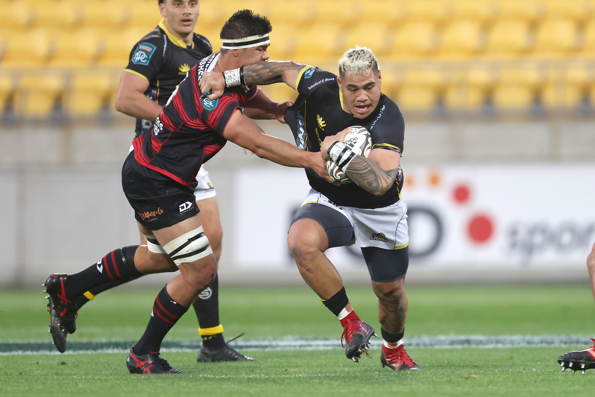 Wellington's Alex Fidow evades a tackle from Canterbury's Reed Prinsep. Photo / Photosport