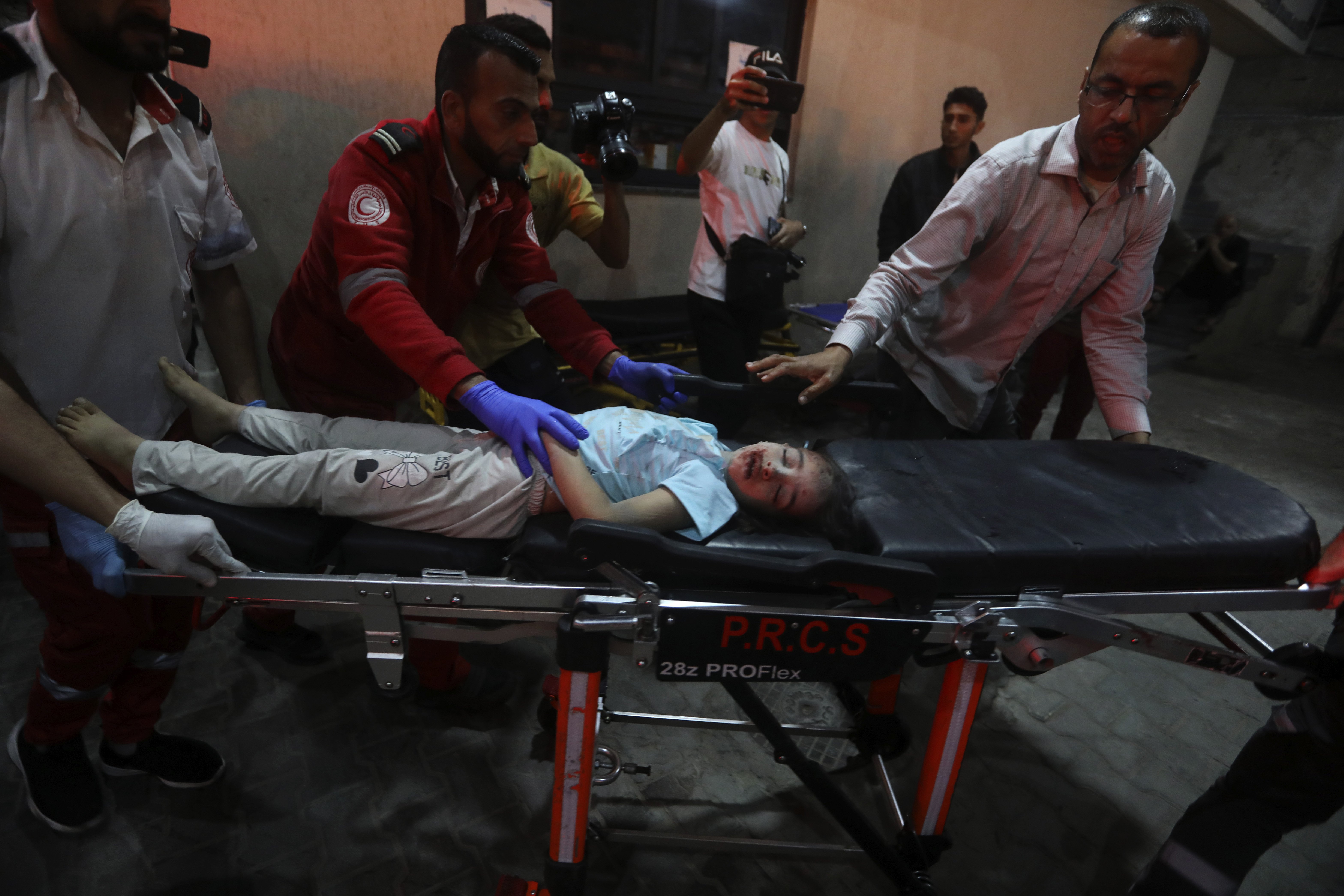 A young Palestinian wounded in the Israeli bombardment of the Gaza Strip is brought to the Kuwaiti Hospital in Rafah refugee camp, southern Gaza Strip. Photo / AP