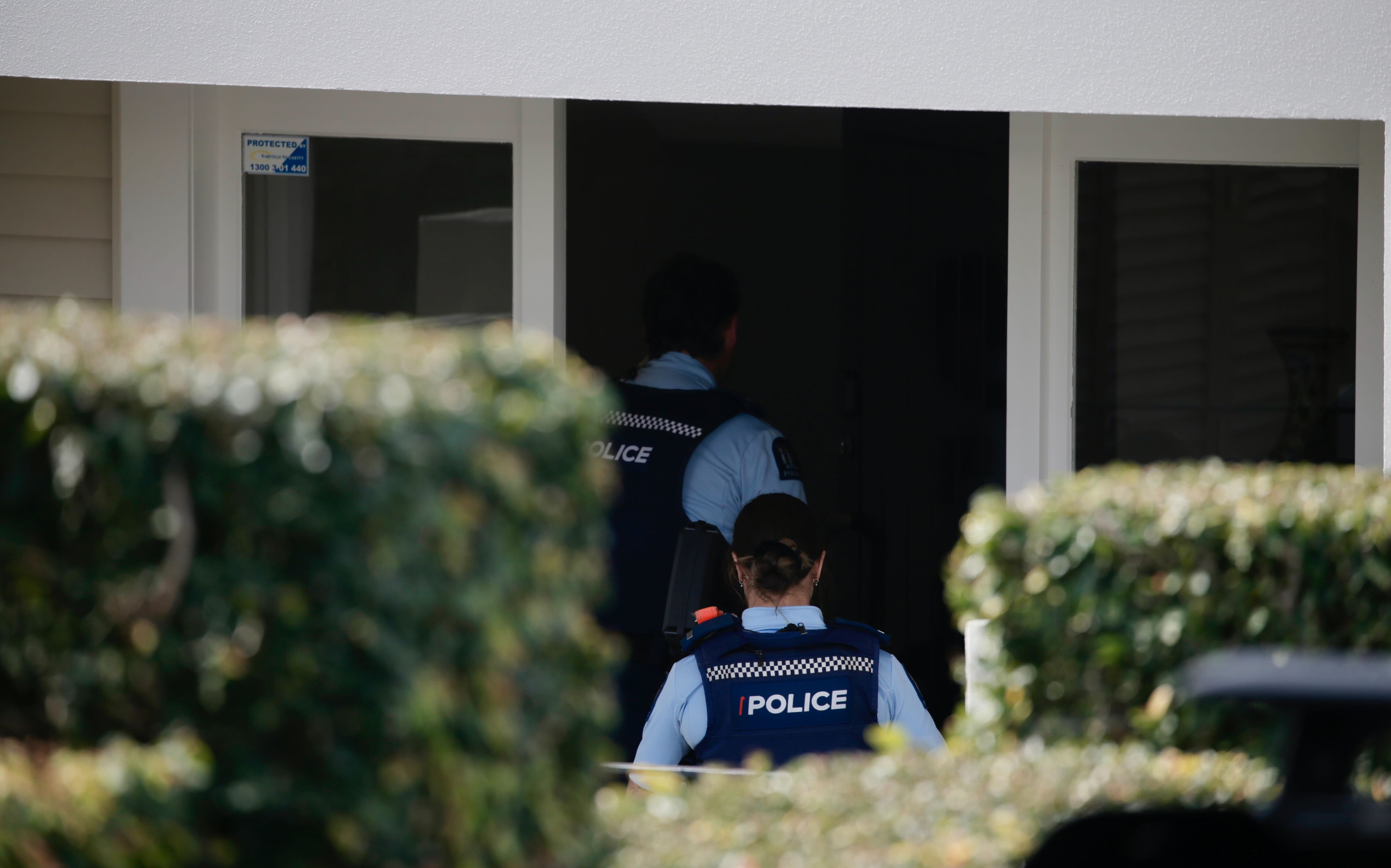Police at the Clarke residence in Remuera, central Auckland, at around noon today. Photo / Alex Burton