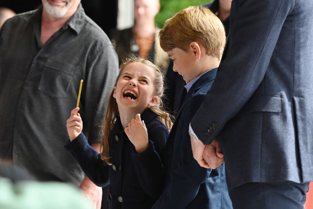 Princess Charlotte was snapped having a good laugh during her first official royal engagement in Wales. Photo / Getty Images