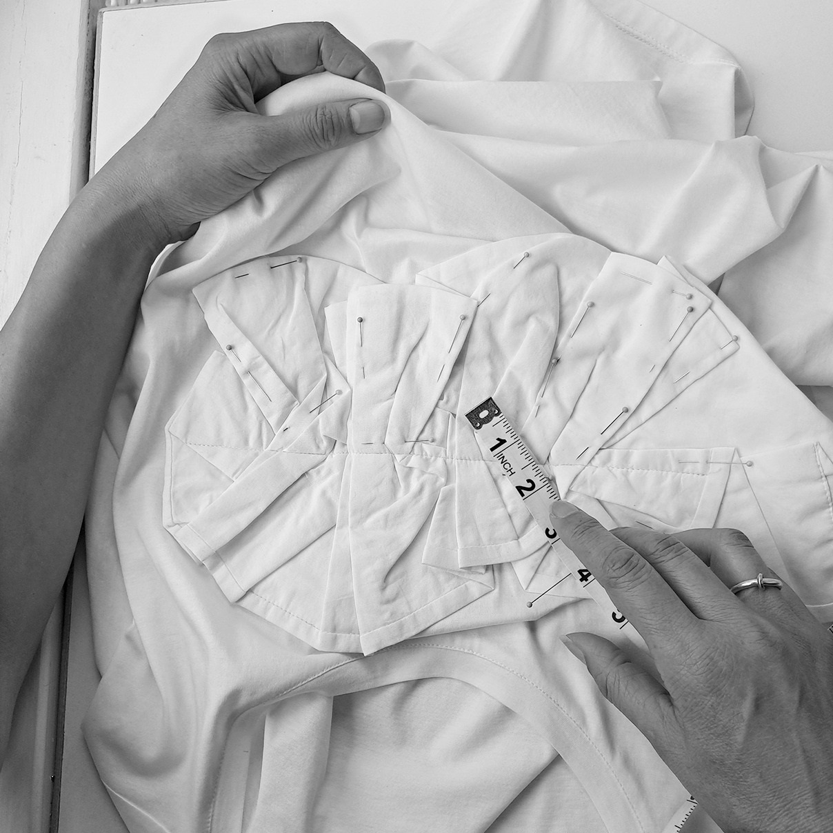 A T-shirt features a folded fabric detail on the front. Photo / @Juliafong_label