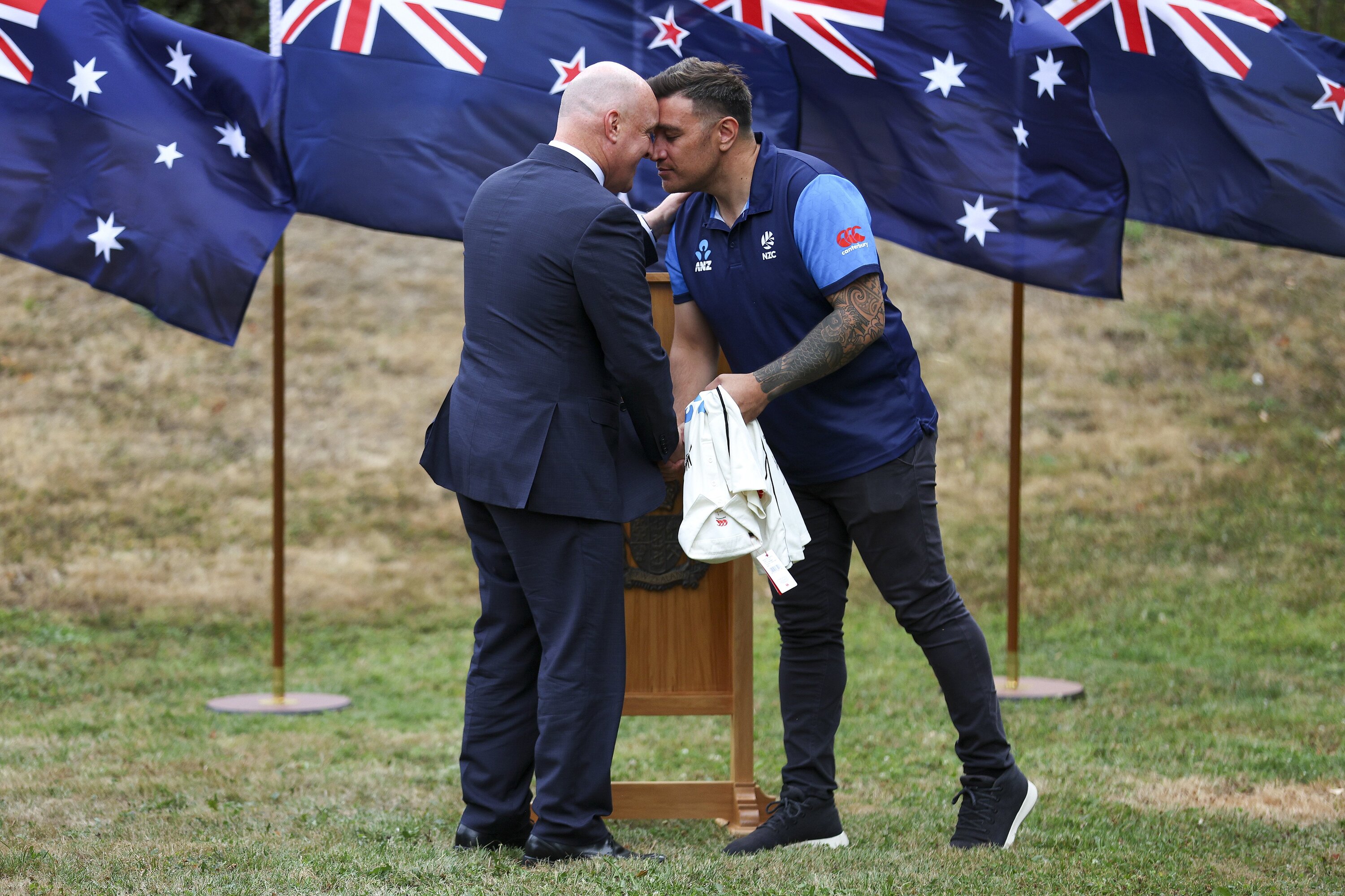 Prime Minister Christopher Luxon is presented with a signed Black Caps shirt by Black Caps diversity and inclusion lead Andrew Tara at Premier House in Wellington. Photo / Hagen Hopkins