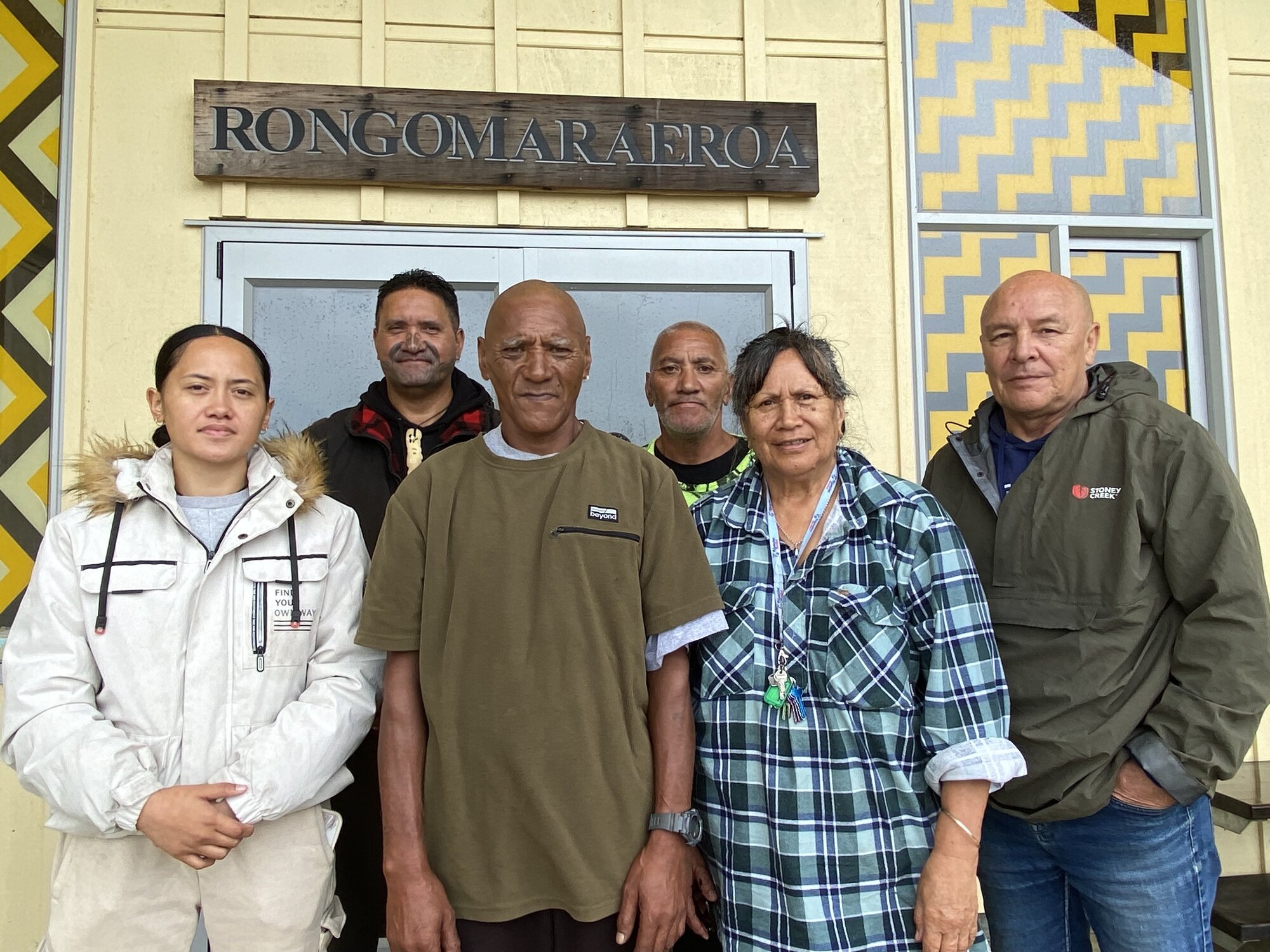 Mōkau Marae provided a central focus for the community during the weekend weather bomb, including grateful flood refugees and visitors (from left) Lavinia Karapu, Dane Karapu, Simon Simeon, Pattinson Wetere, Taunaha Brown and Clive Stone.  Photo / Susan Botting 