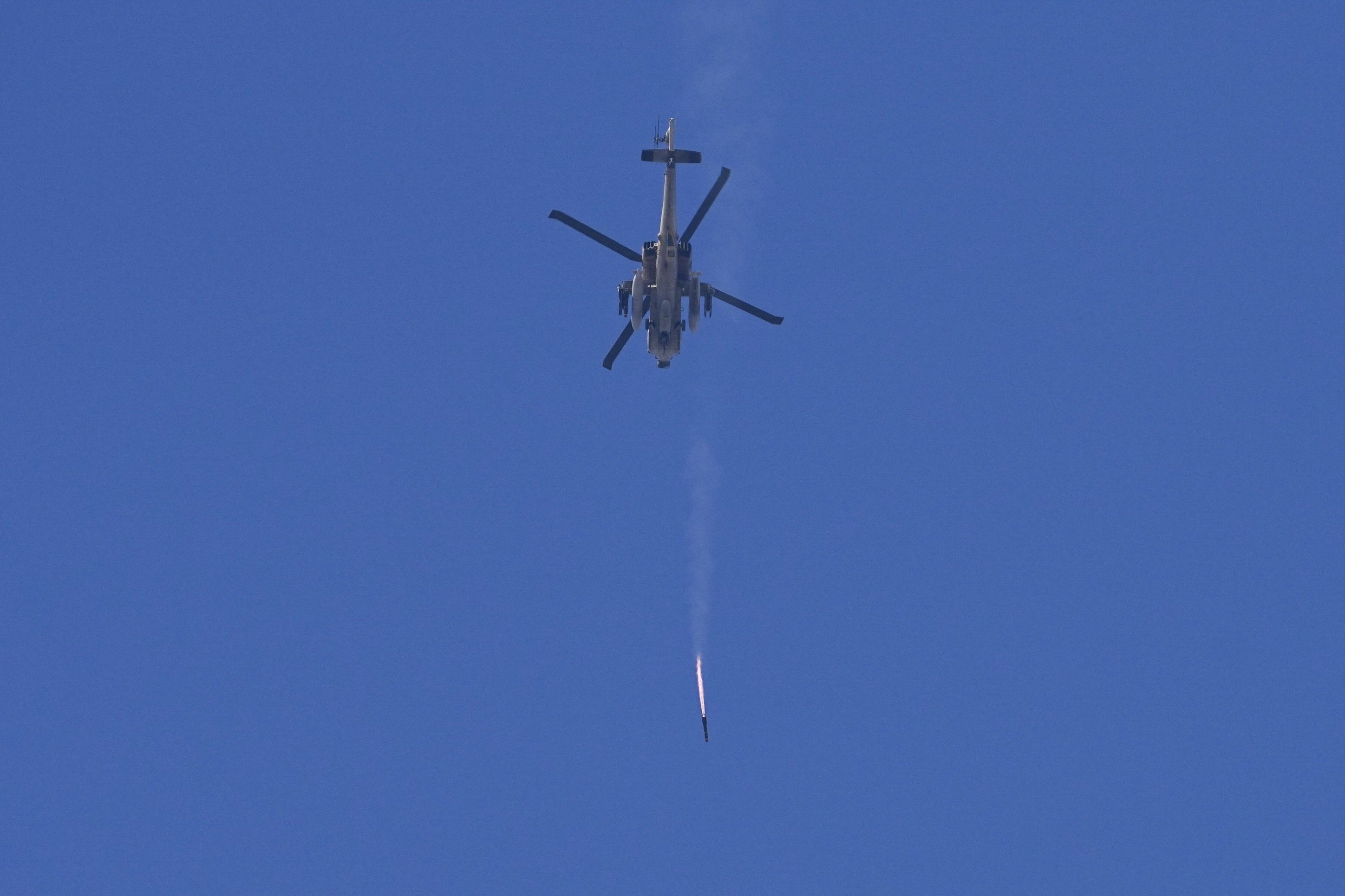 An Israeli Apache helicopter fires a missile in direction of the Gaza Strip. Photo / AP