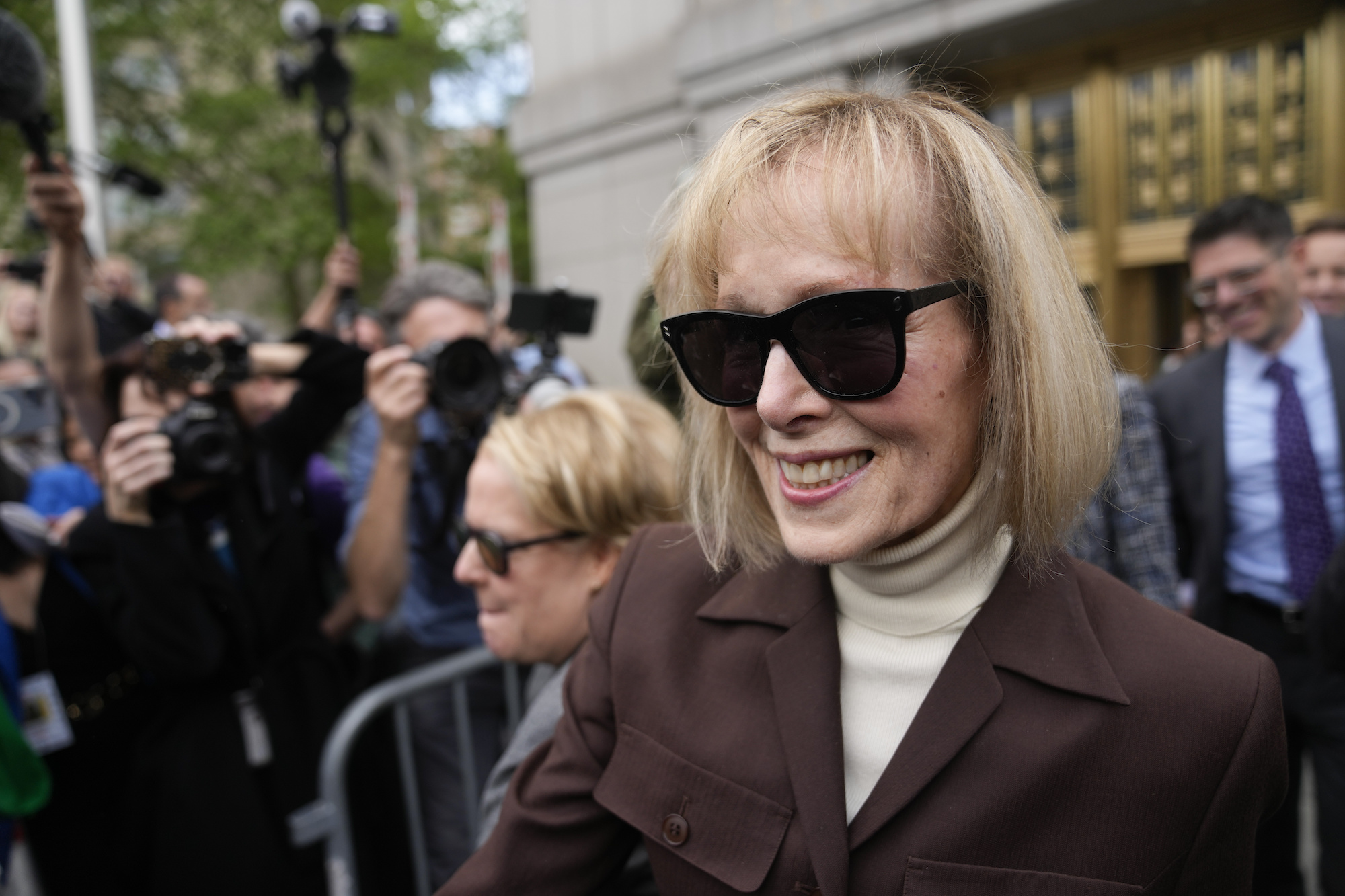 E. Jean Carroll walks out of Manhattan federal court in New York after a jury found Donald Trump liable for sexually abusing her in 1996. Photo / AP