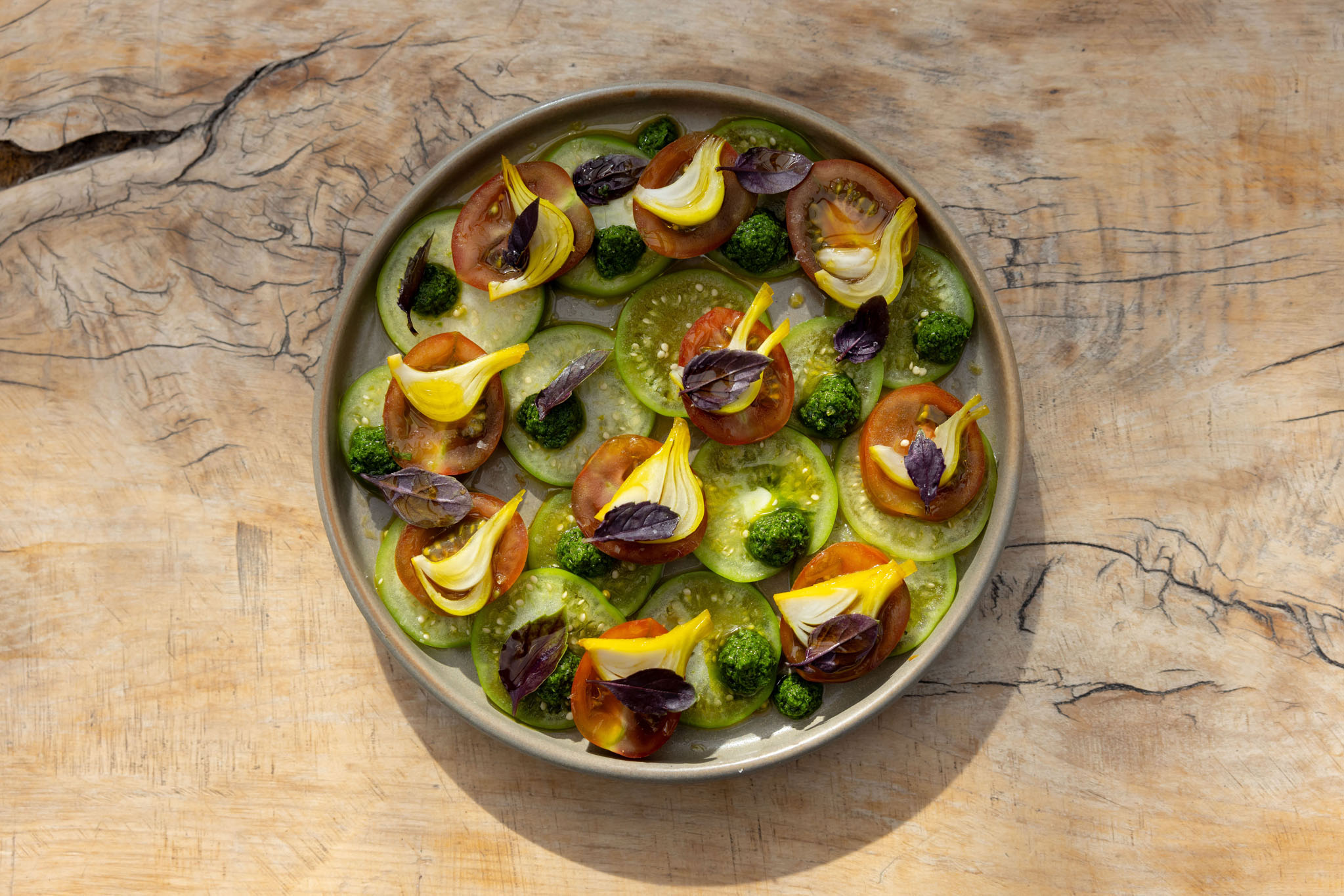 Only round tomatoes here — Sherwood's homegrown heirlooms, plus pickled salad onions and salsa verde from the restaurant’s garden. Photo / Jono Parker
