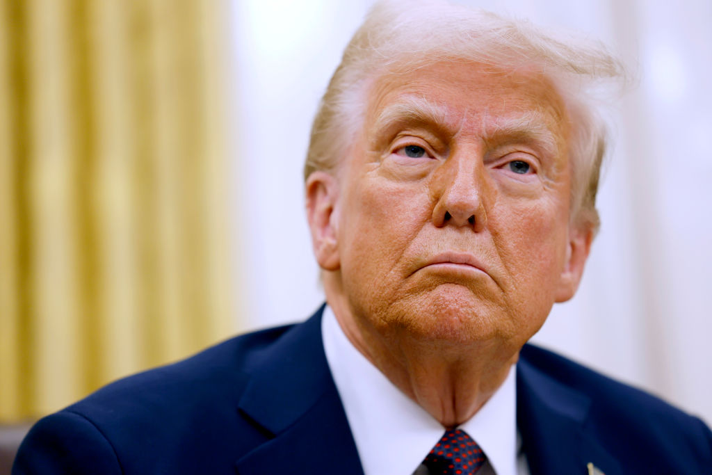 US President Donald Trump speaks to reporters after signing a series of executive orders in the Oval Office of the White House. Photo / Getty Images