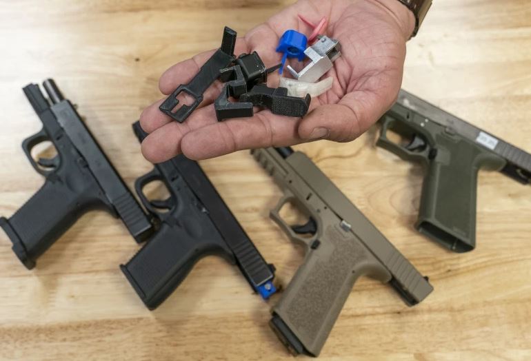 A handful of fully automatic conversion devices. Photo / AP