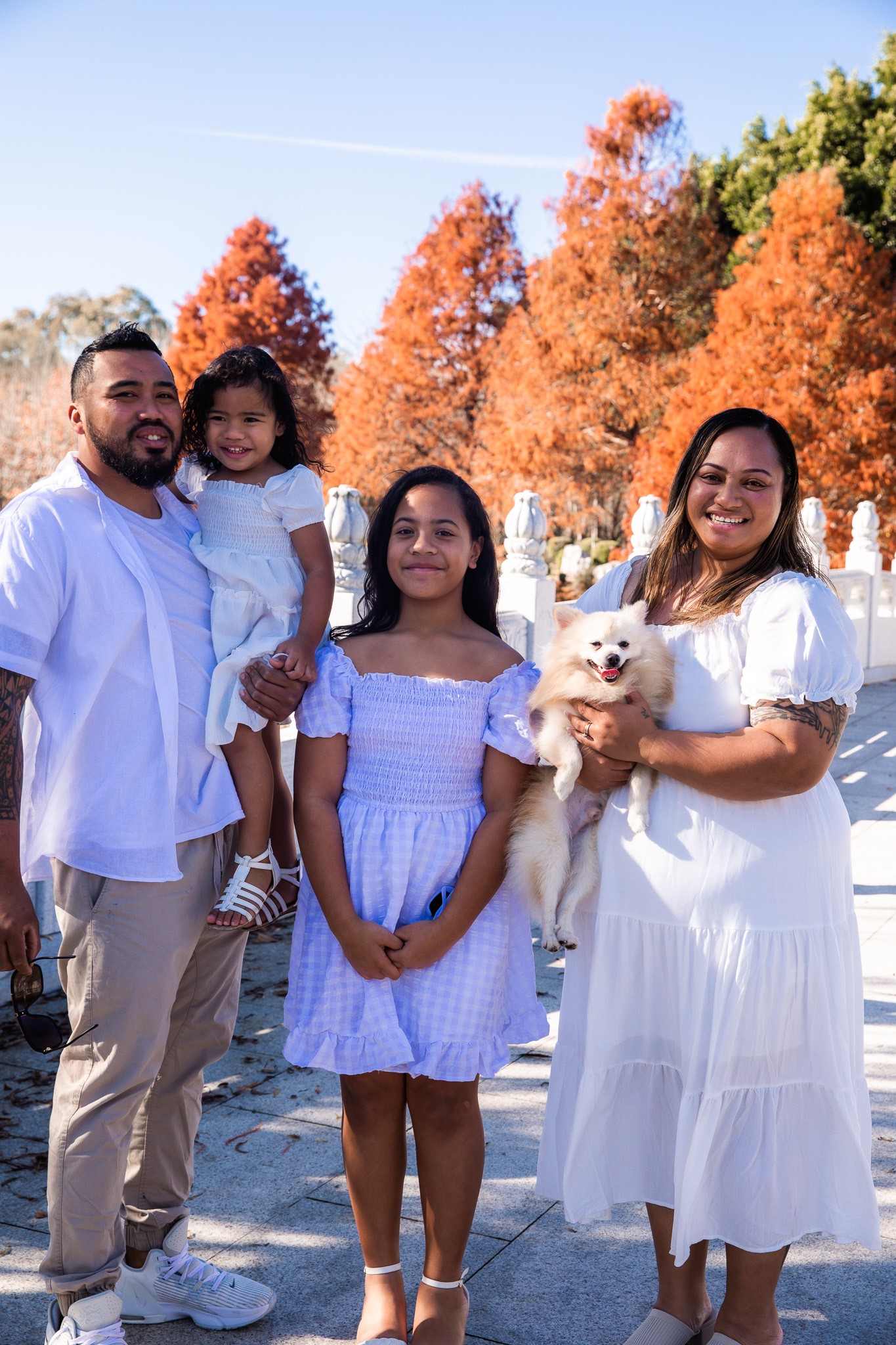 Keitah Tuleitu with husband Patrick, daughters Elaena, 11, and Ella-Jay, 3, and pooch Breezy. Keitah moved to Western Sydney in 2016 and says higher salaries have made her life much more comfortable.