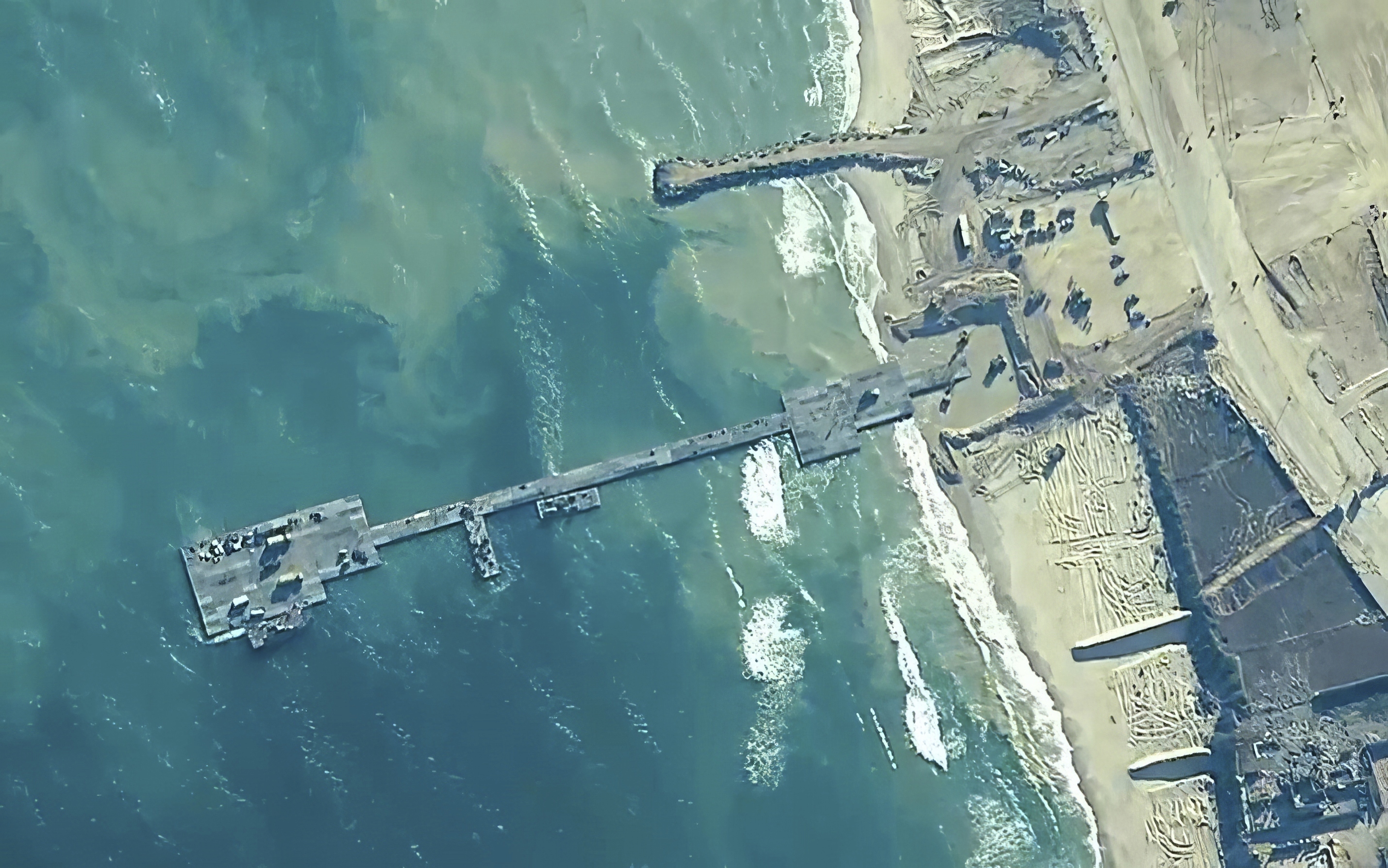 A key section of the US military-built pier designed to carry badly needed aid into Gaza by boat has been reconnected to the Gaza beach following storm damage repairs and aid will begin to flow soon, the US Central Command announced on Friday. Photo / AP