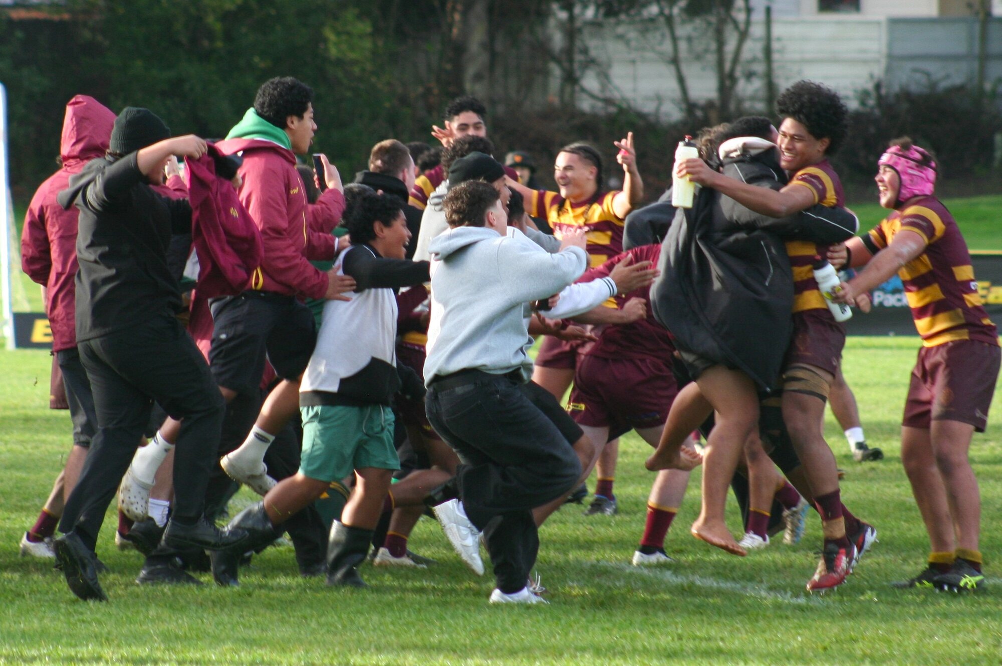 Supporters run on to the field after Liston beat King's College. Photo / Bruce Holloway