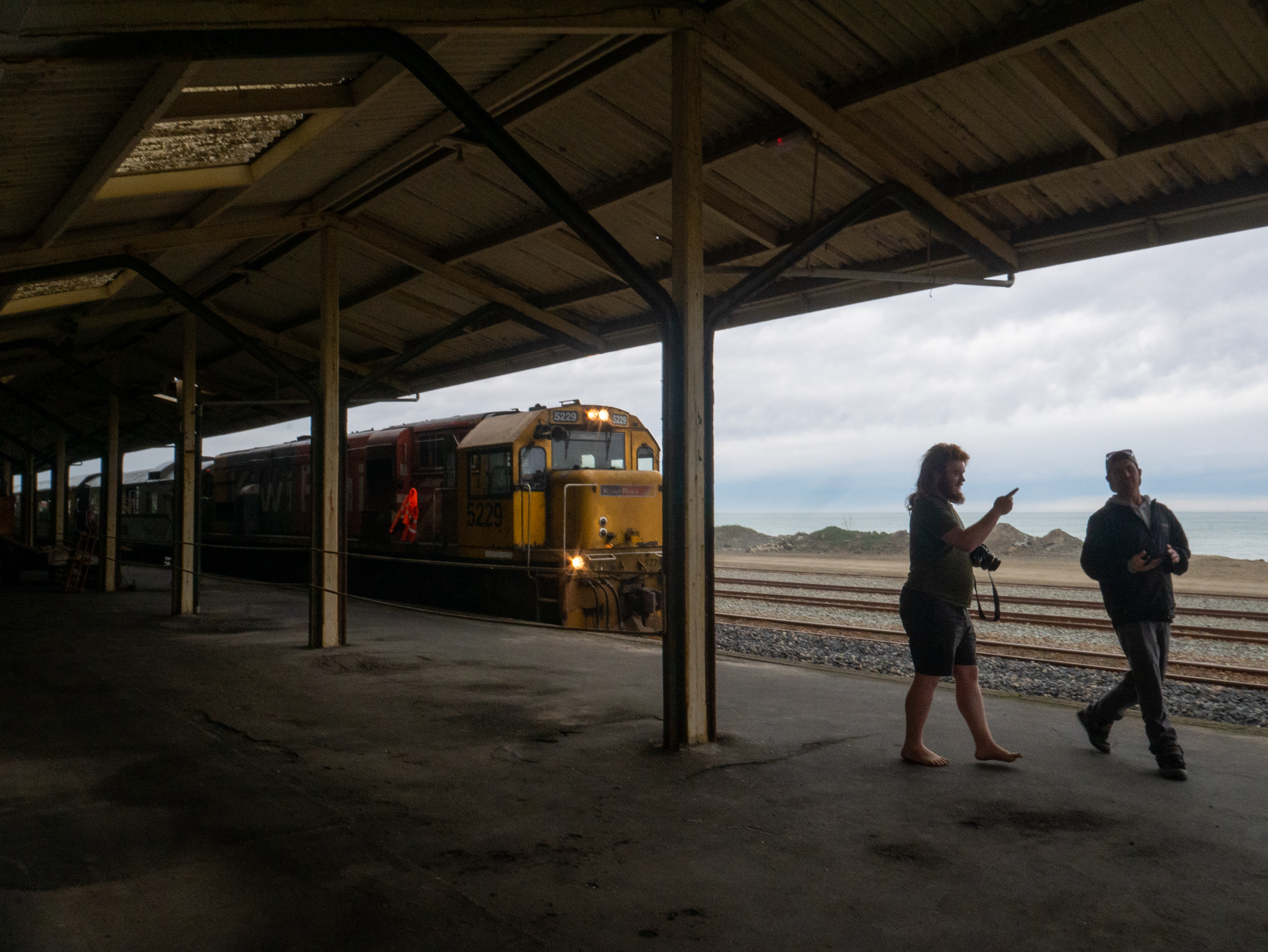 Trainspotters greet the chartered carriage in Oamaru Station. Photo / Thomas Bywater