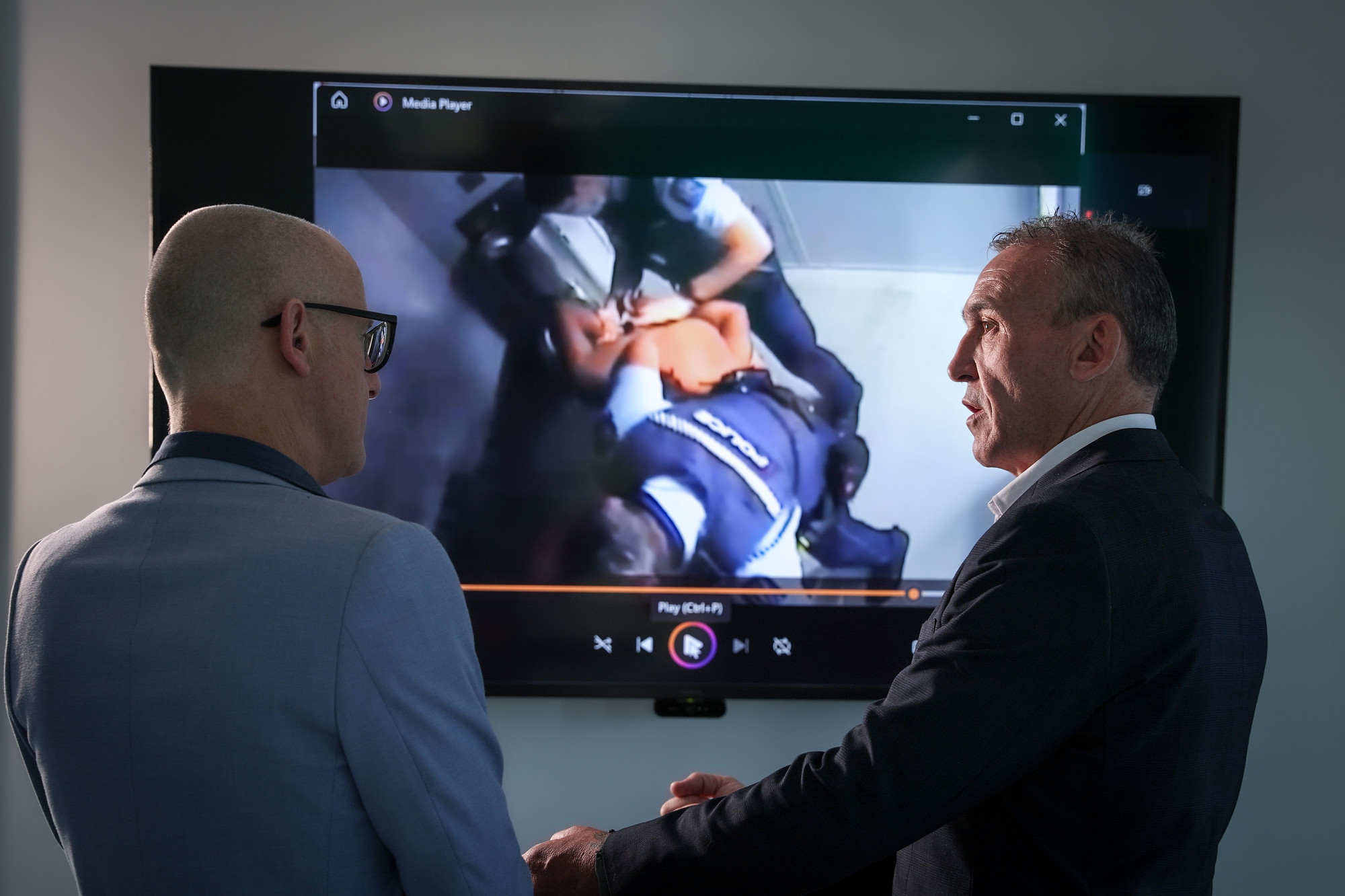 Journalist David Fisher (left) and private investigator Mike Sabin review police CCTV footage relating to Jamie Lawry. Photo / Michael Craig