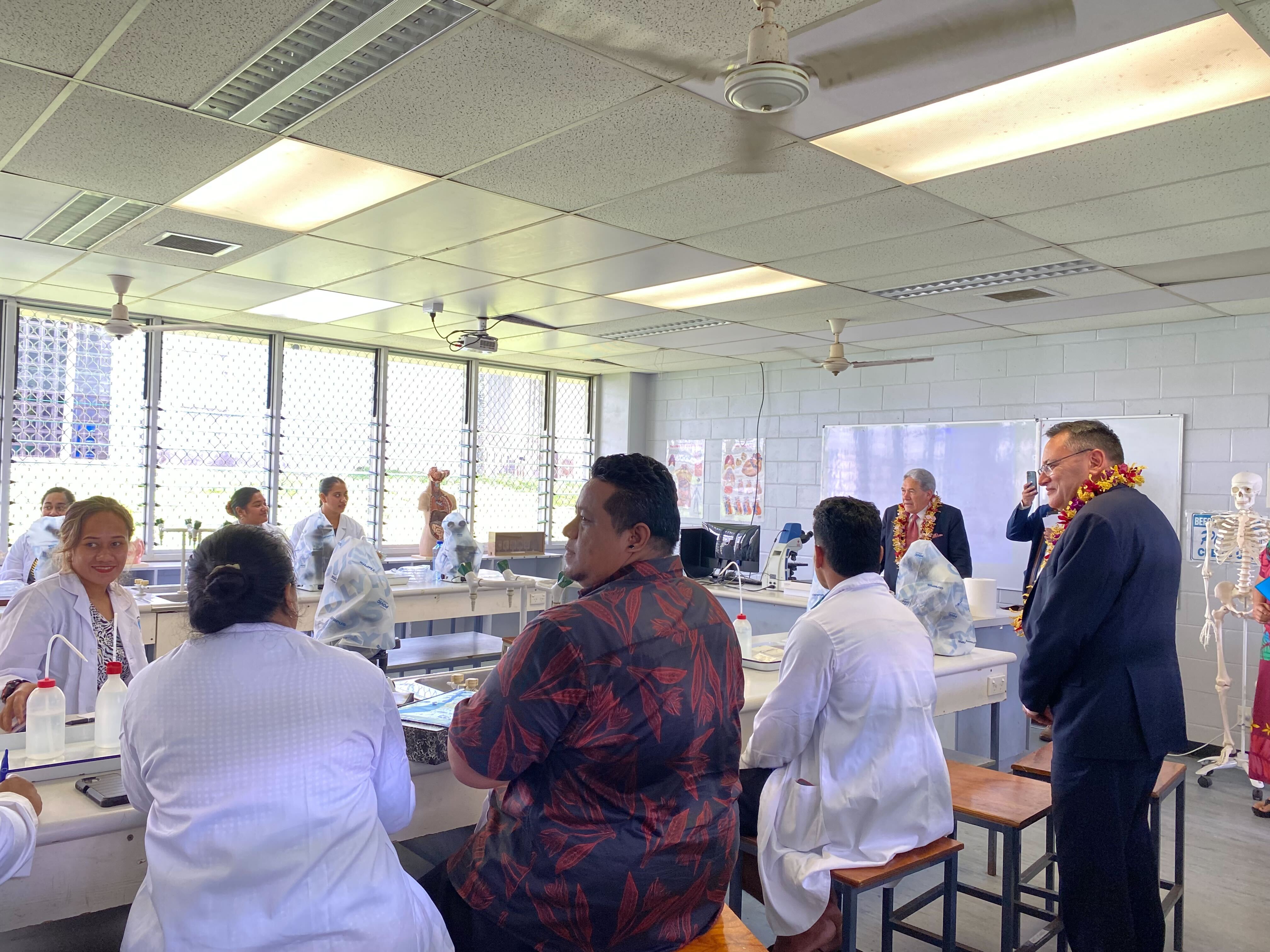 Winston Peters and Dr Shane Reti meet students at the National University of Samoa. Photo / Vaimoana Mase