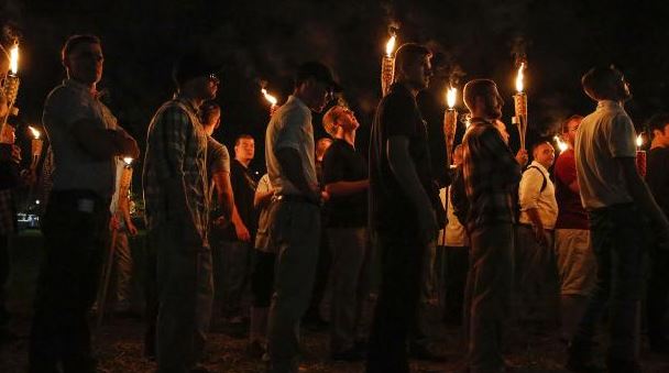 Multiple white nationalist groups march with torches through the University of Virginia campus in Charlottesville. Photo: Mykal McEldowney/The Indianapolis Star via AP