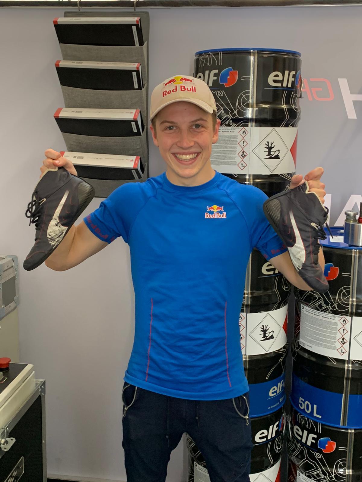 Kiwi driver Liam Lawson shows off his boots ... worn by Red Bull driver Max Verstappen at the Azerbaijan Grand Prix in Baku. Photo / Supplied