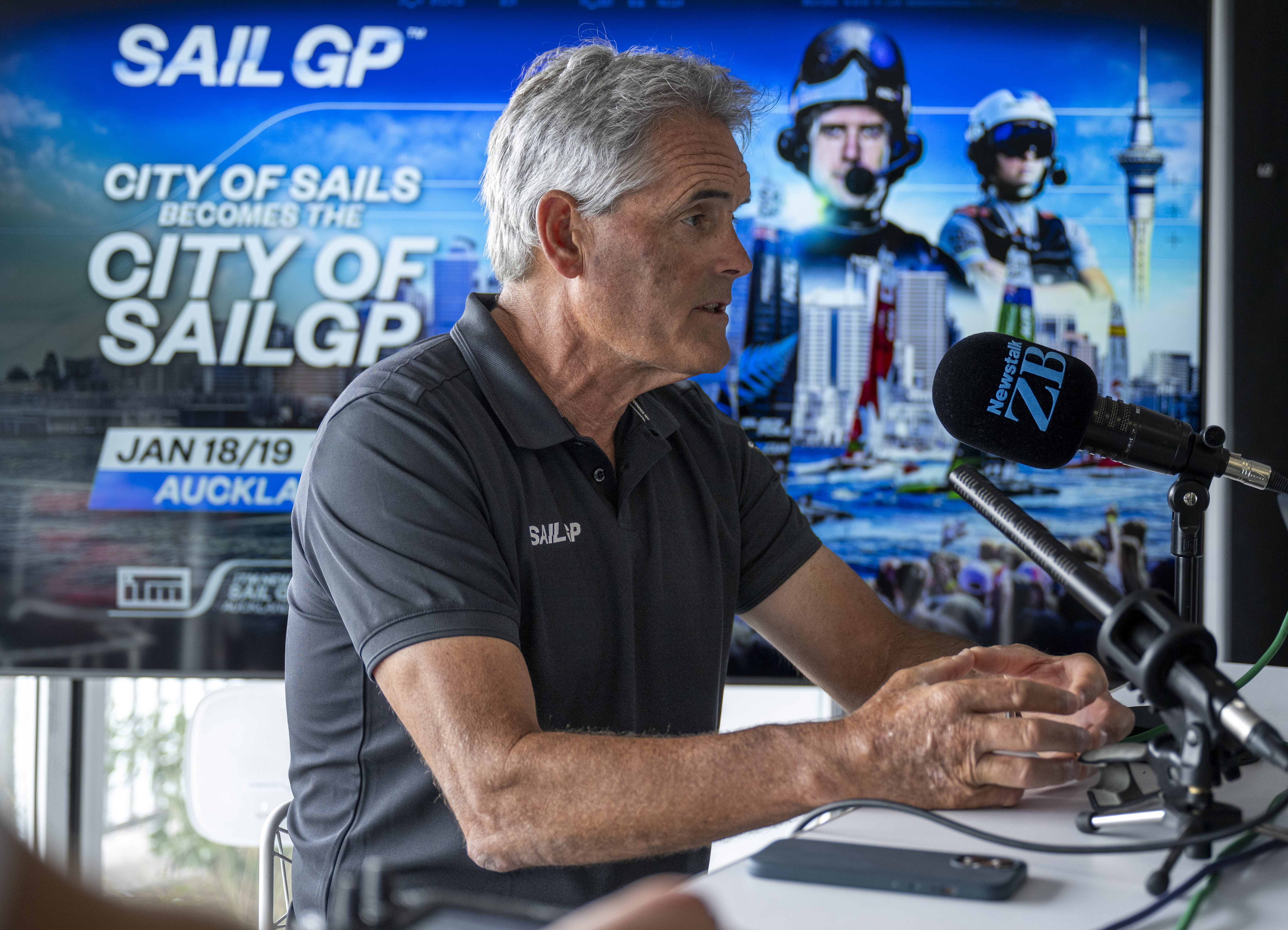 Sir Russell Coutts speaks to Newstalk ZB's Jason Pine during the Auckland SailGP event. Photo / Jason Ludlow, SailGP
